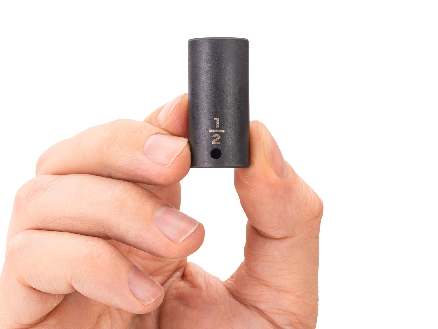 Person holding Tekton impact drive 6-point socket. Item #SID04013