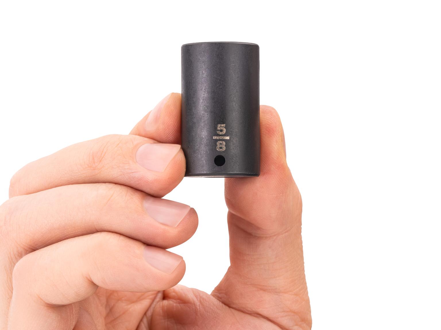 Person holding Tekton impact drive 6-point socket. Item #SID04016