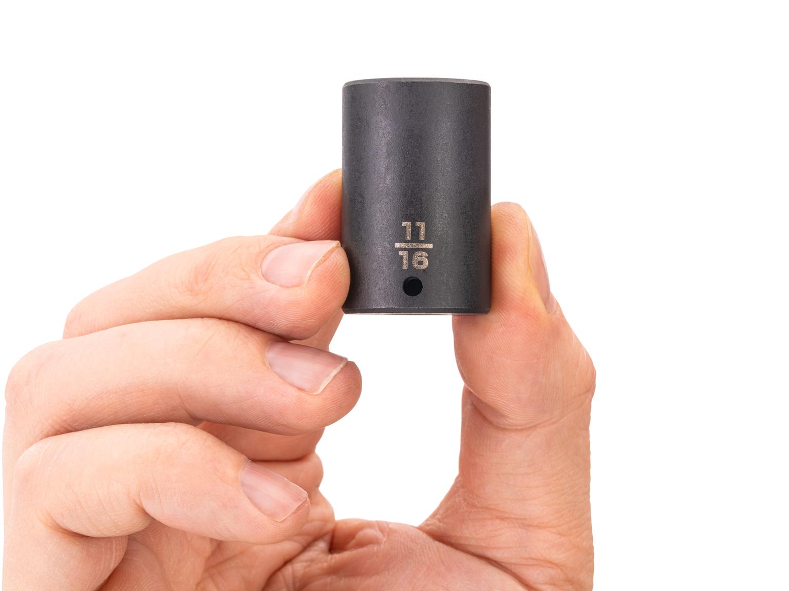 Person holding Tekton impact drive 6-point socket. Item #SID04017