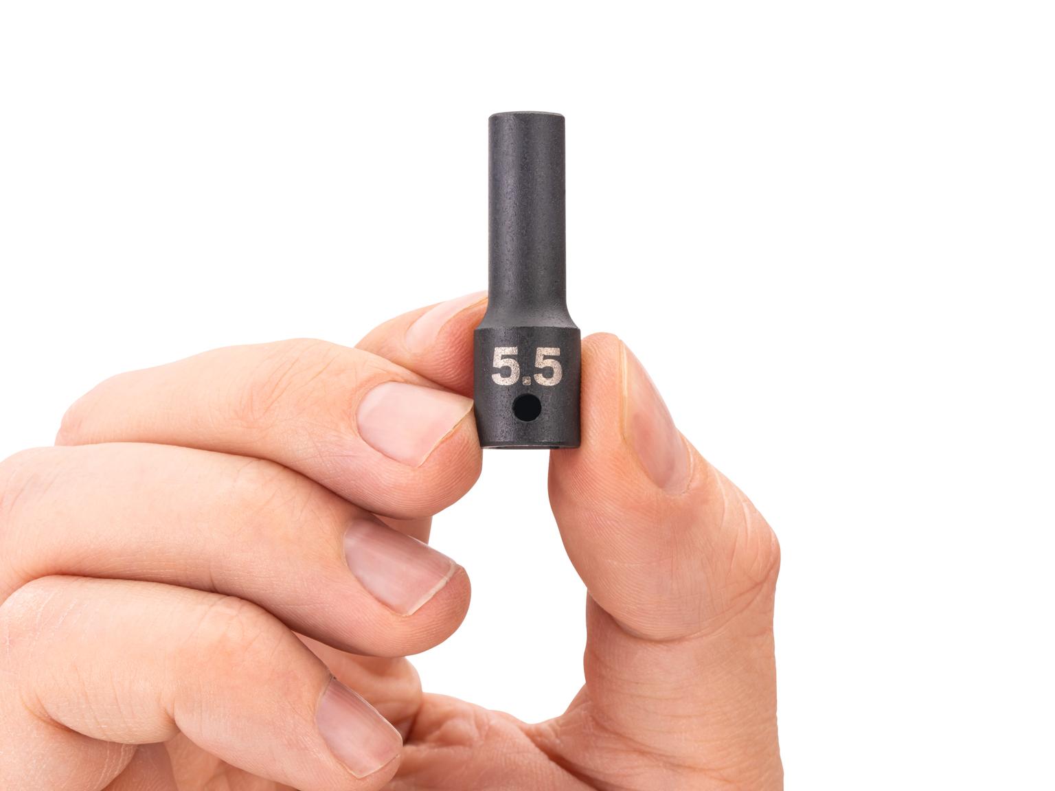 Person holding Tekton impact drive 6-point socket. Item #SID04105