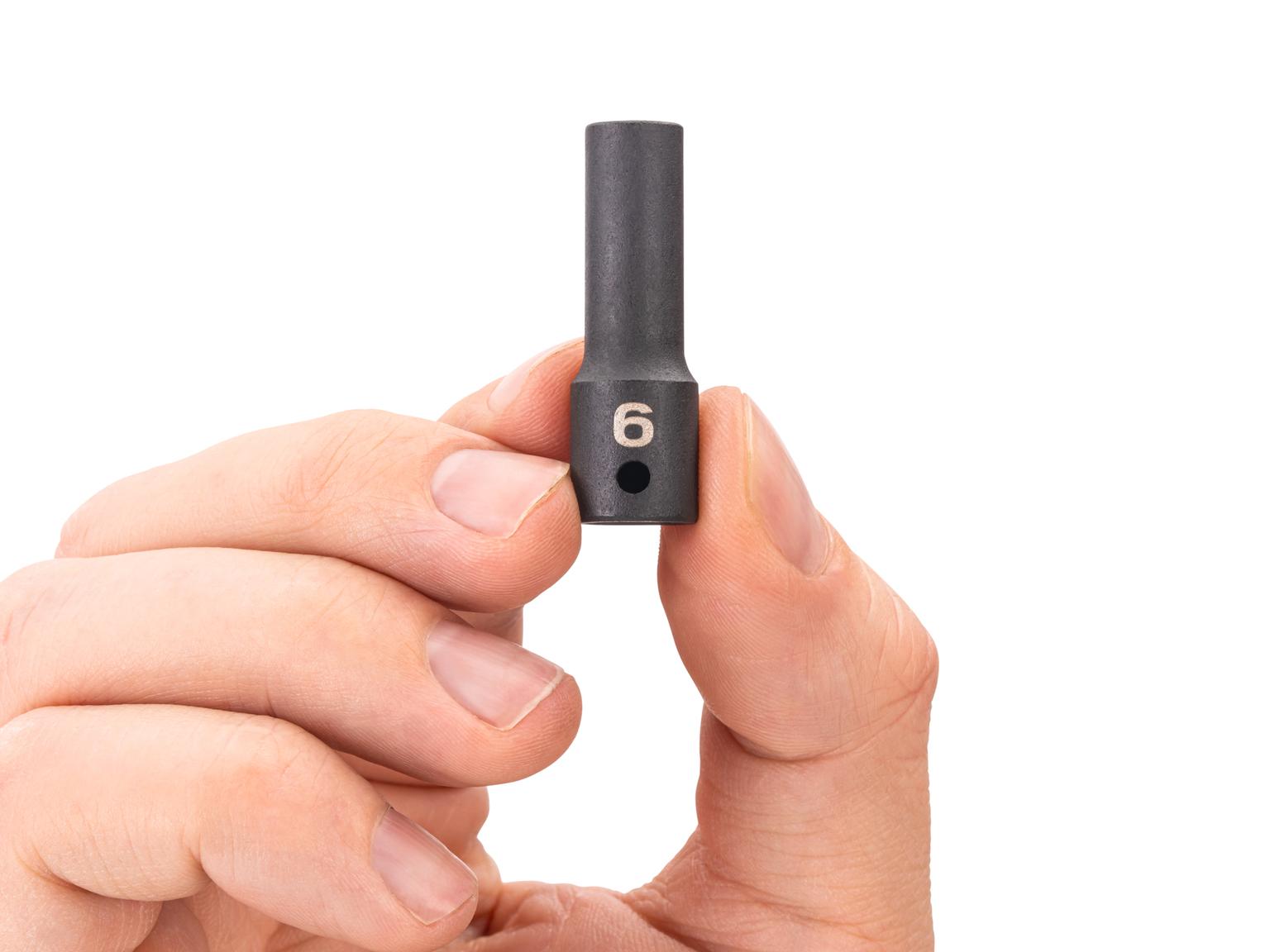 Person holding Tekton impact drive 6-point socket. Item #SID04106