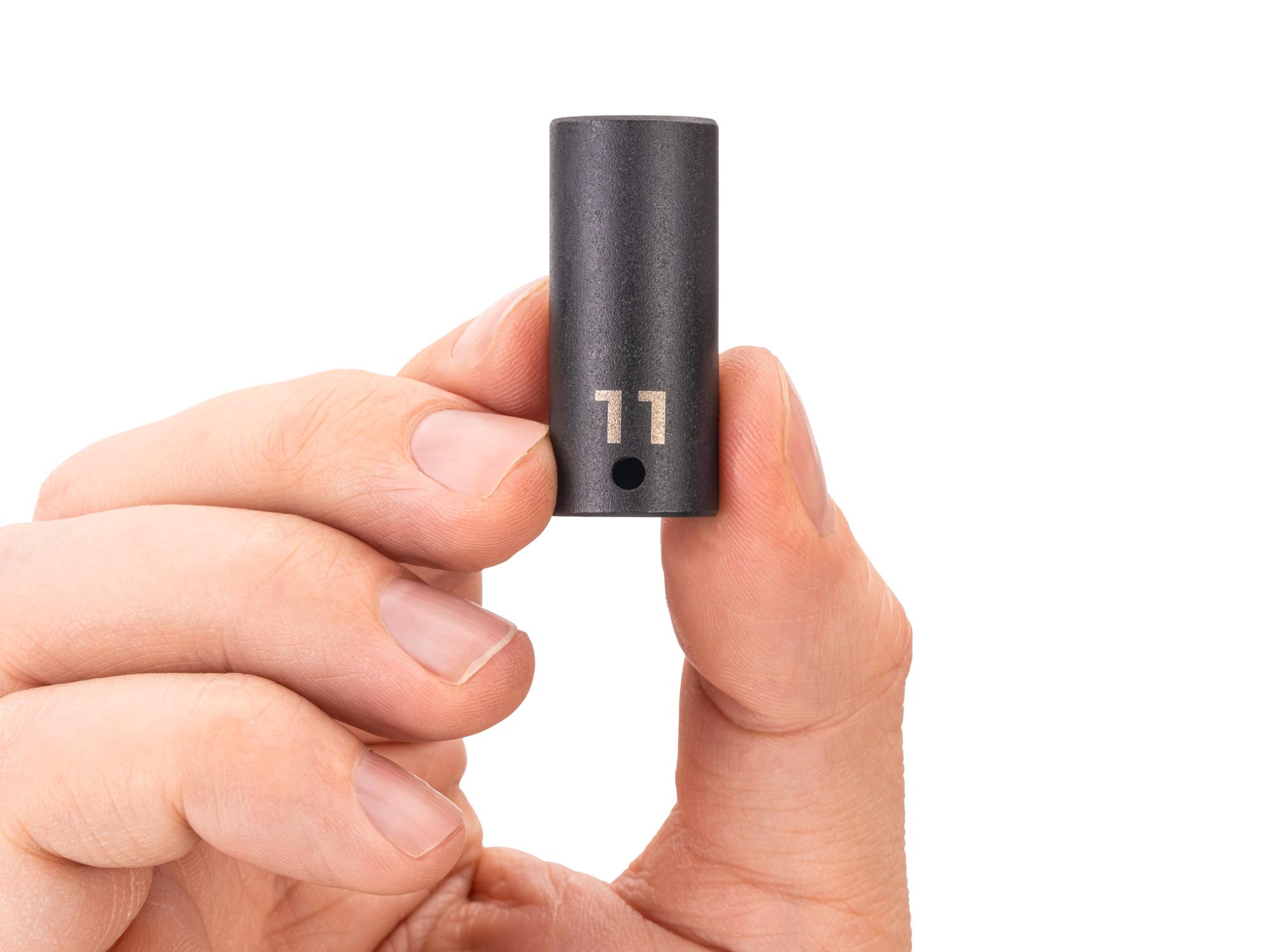 Person holding Tekton impact drive 6-point socket. Item #SID04111