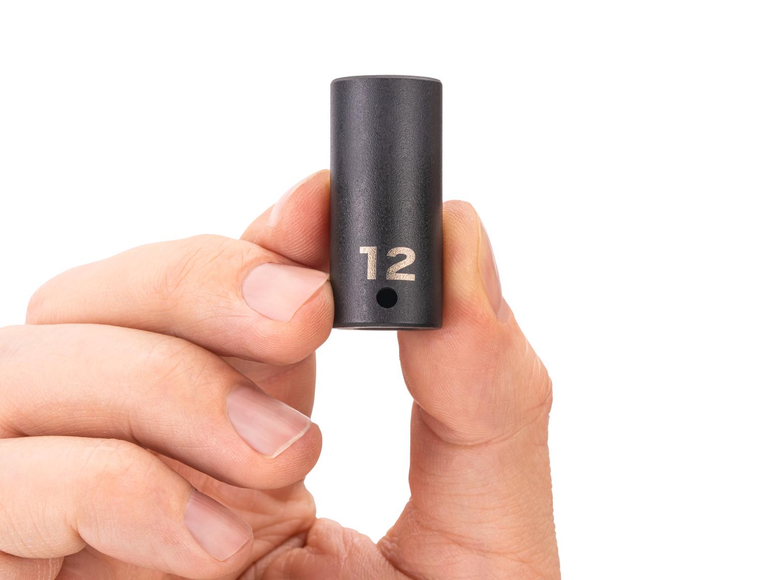 Person holding Tekton impact drive 6-point socket. Item #SID04112