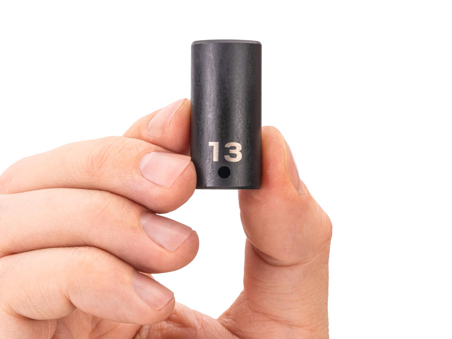 Person holding Tekton impact drive 6-point socket. Item #SID04113