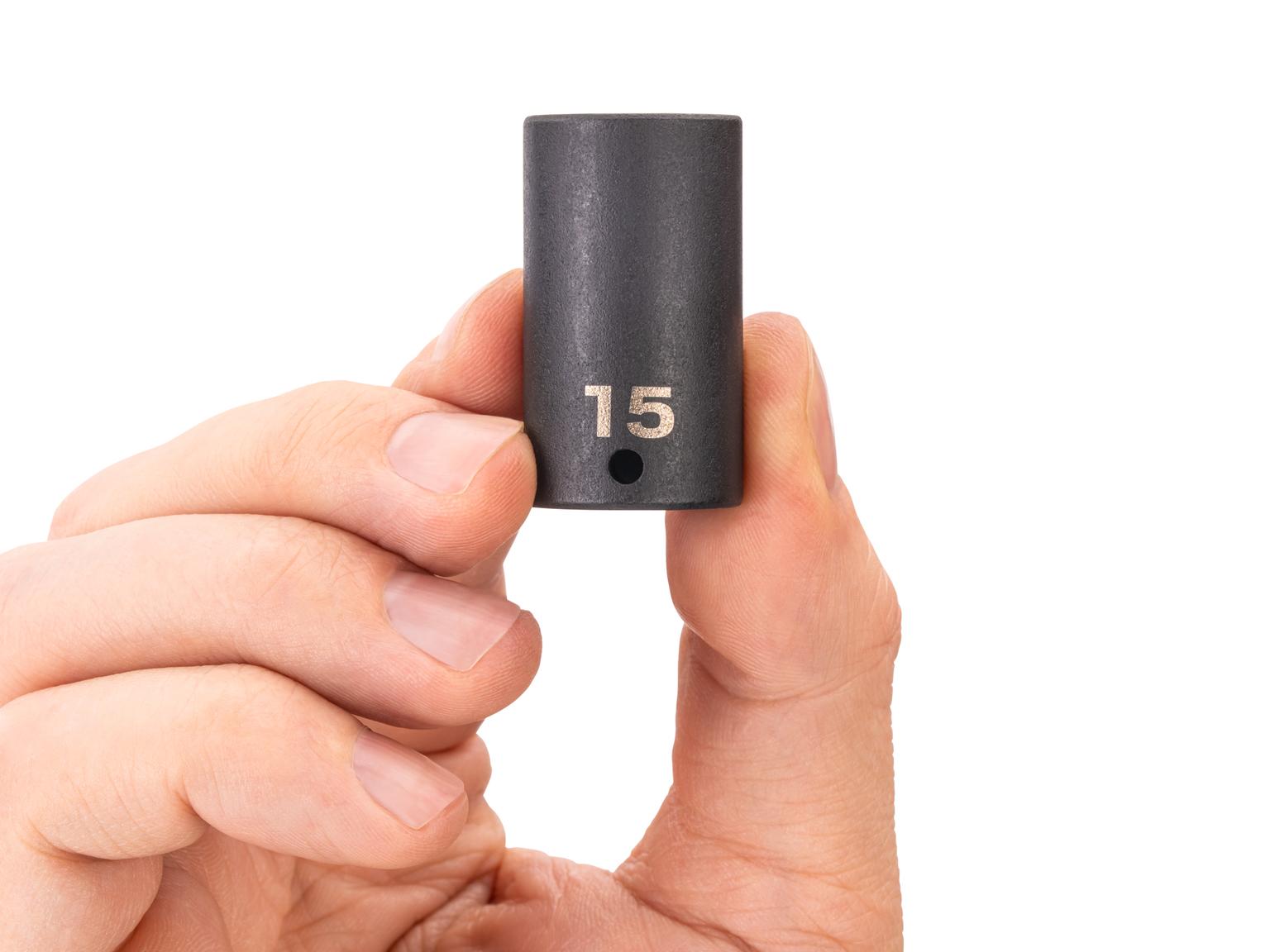 Person holding Tekton impact drive 6-point socket. Item #SID04115