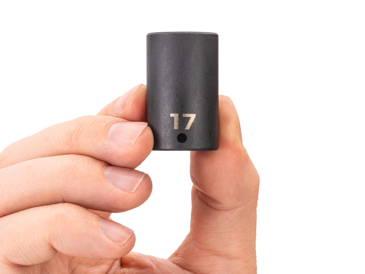 Person holding Tekton impact drive 6-point socket. Item #SID04117