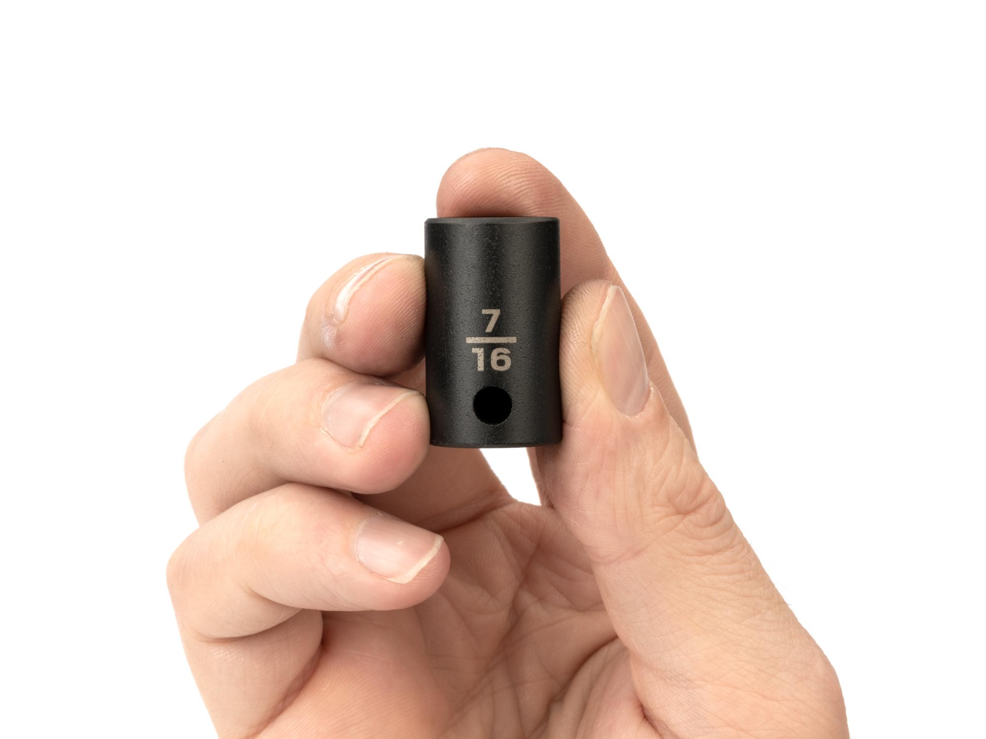 Person holding Tekton impact drive 6-point socket. Item #SID12011