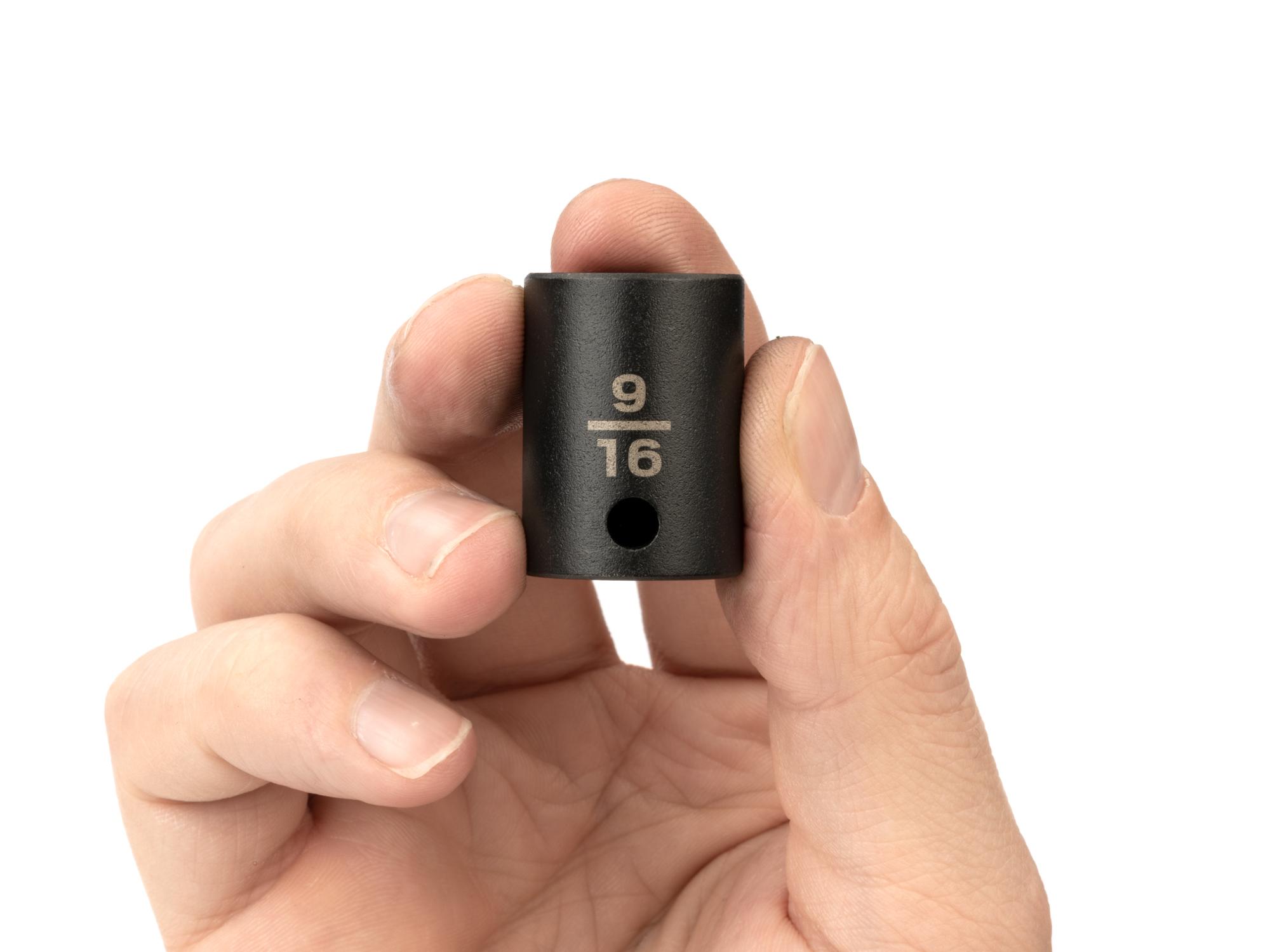 Person holding Tekton impact drive 6-point socket. Item #SID12014