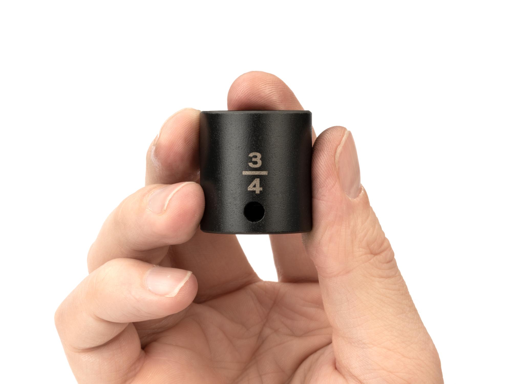 Person holding Tekton impact drive 6-point socket. Item #SID12019