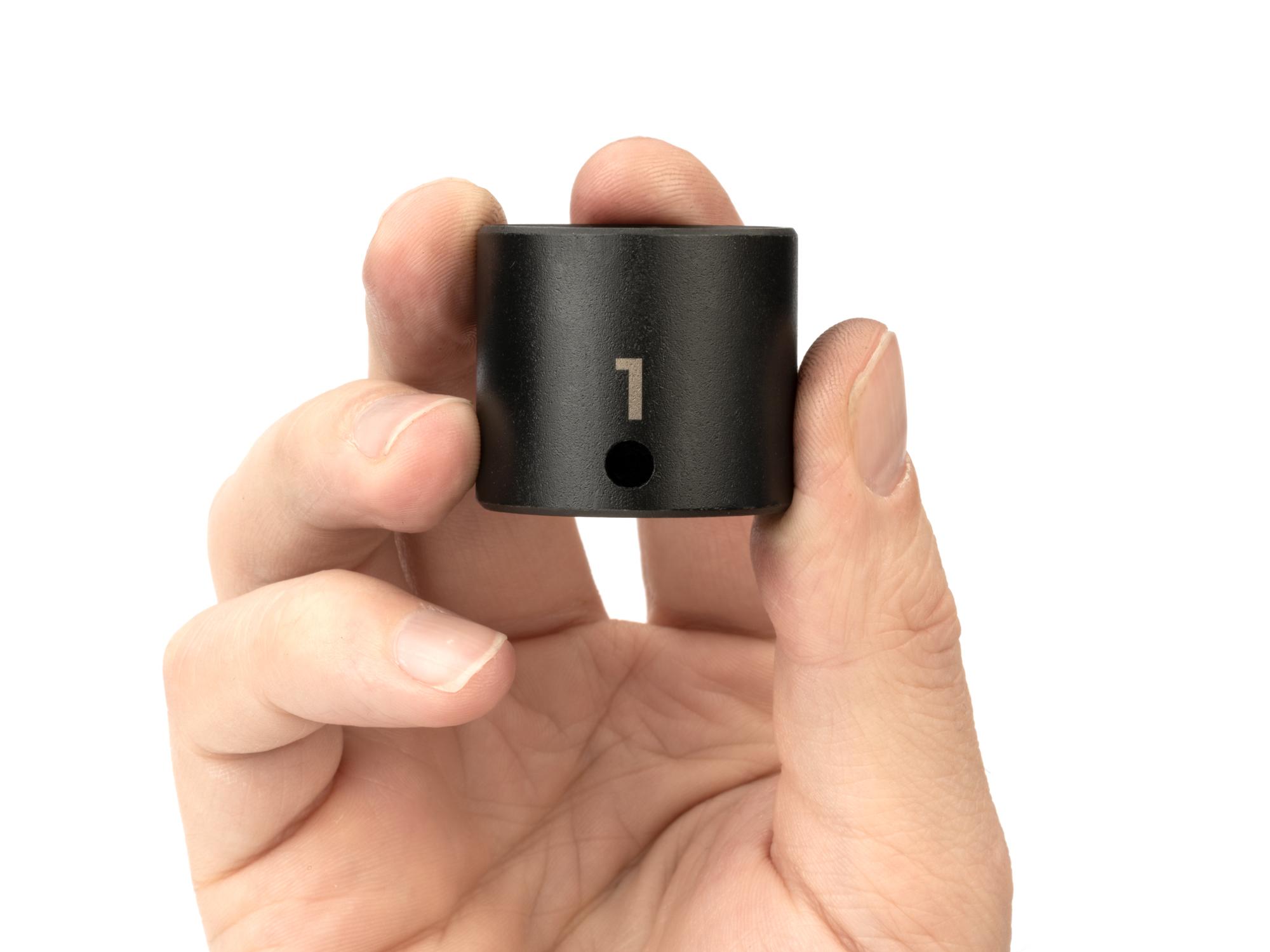 Person holding Tekton impact drive 6-point socket. Item #SID12025