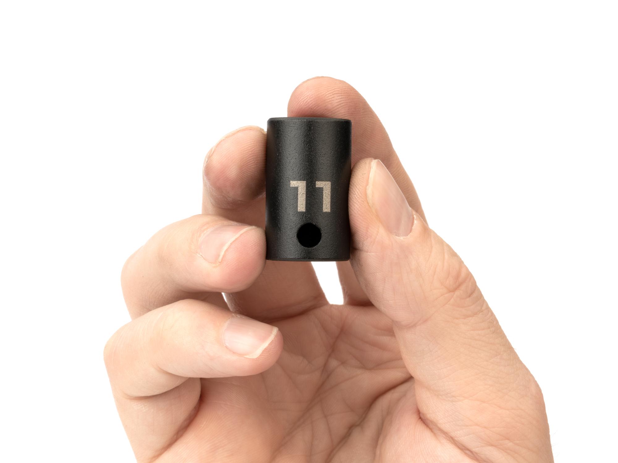 Person holding Tekton impact drive 6-point socket. Item #SID12111