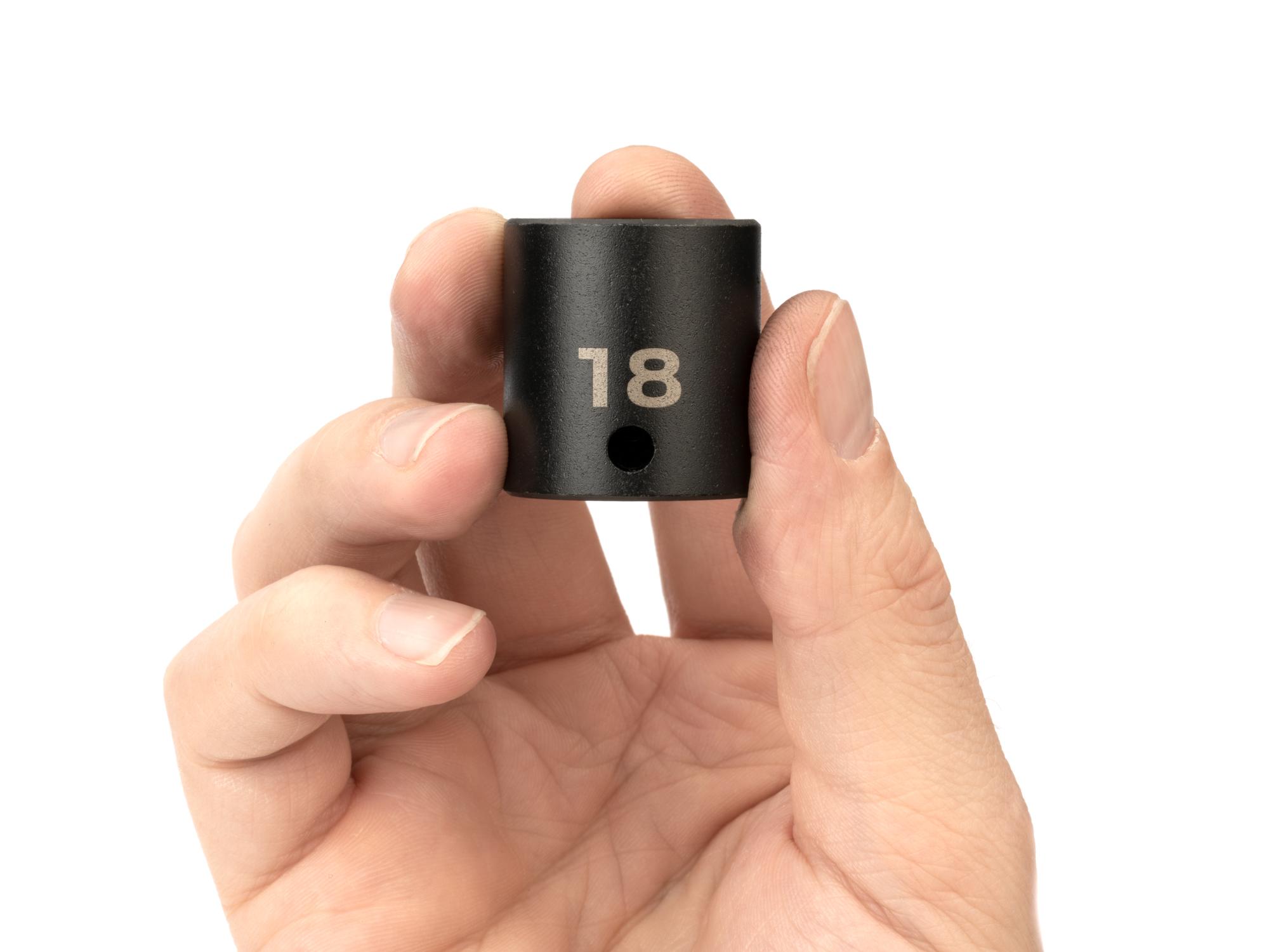 Person holding Tekton impact drive 6-point socket. Item #SID12118