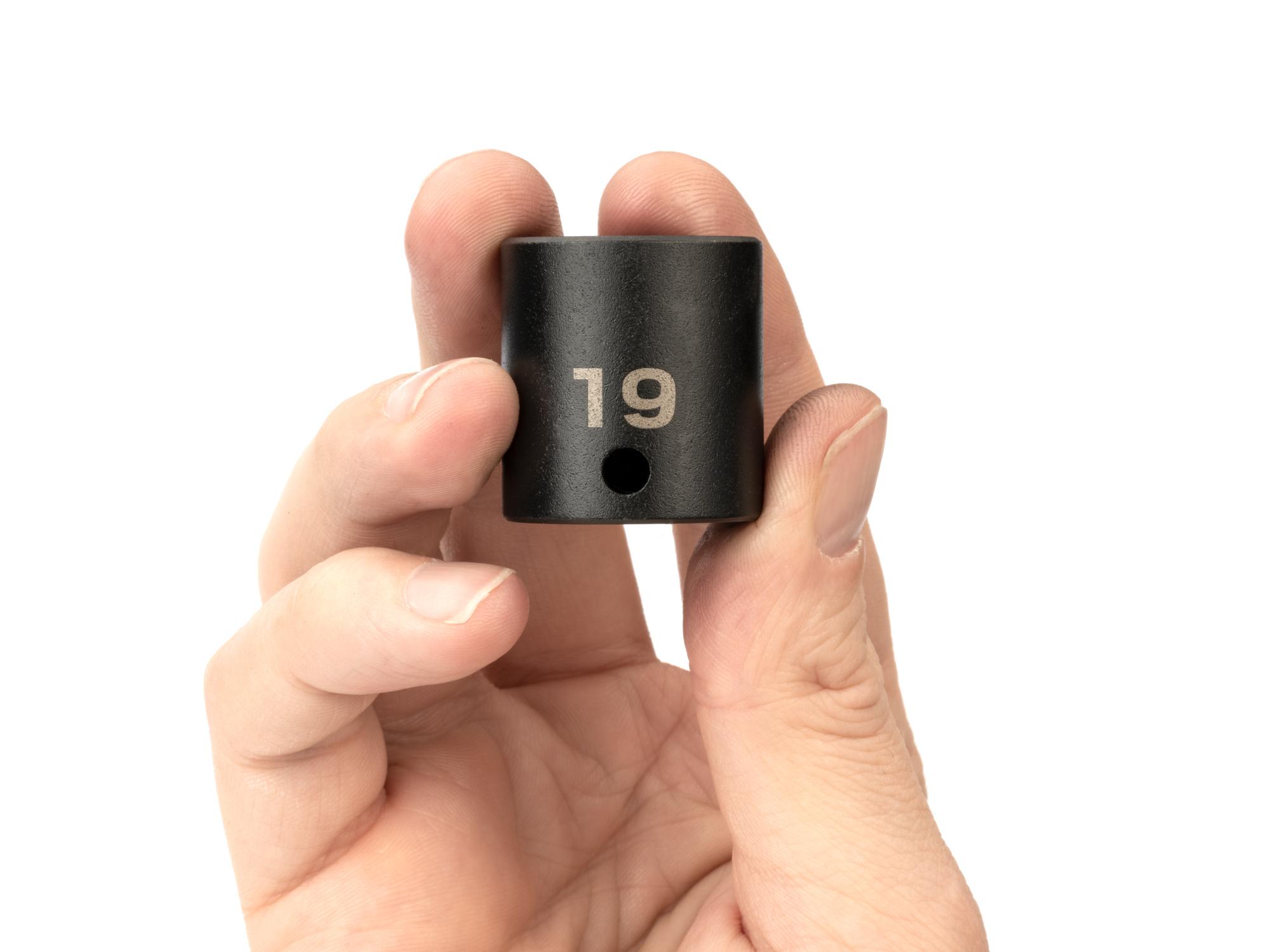 Person holding Tekton impact drive 6-point socket. Item #SID12119