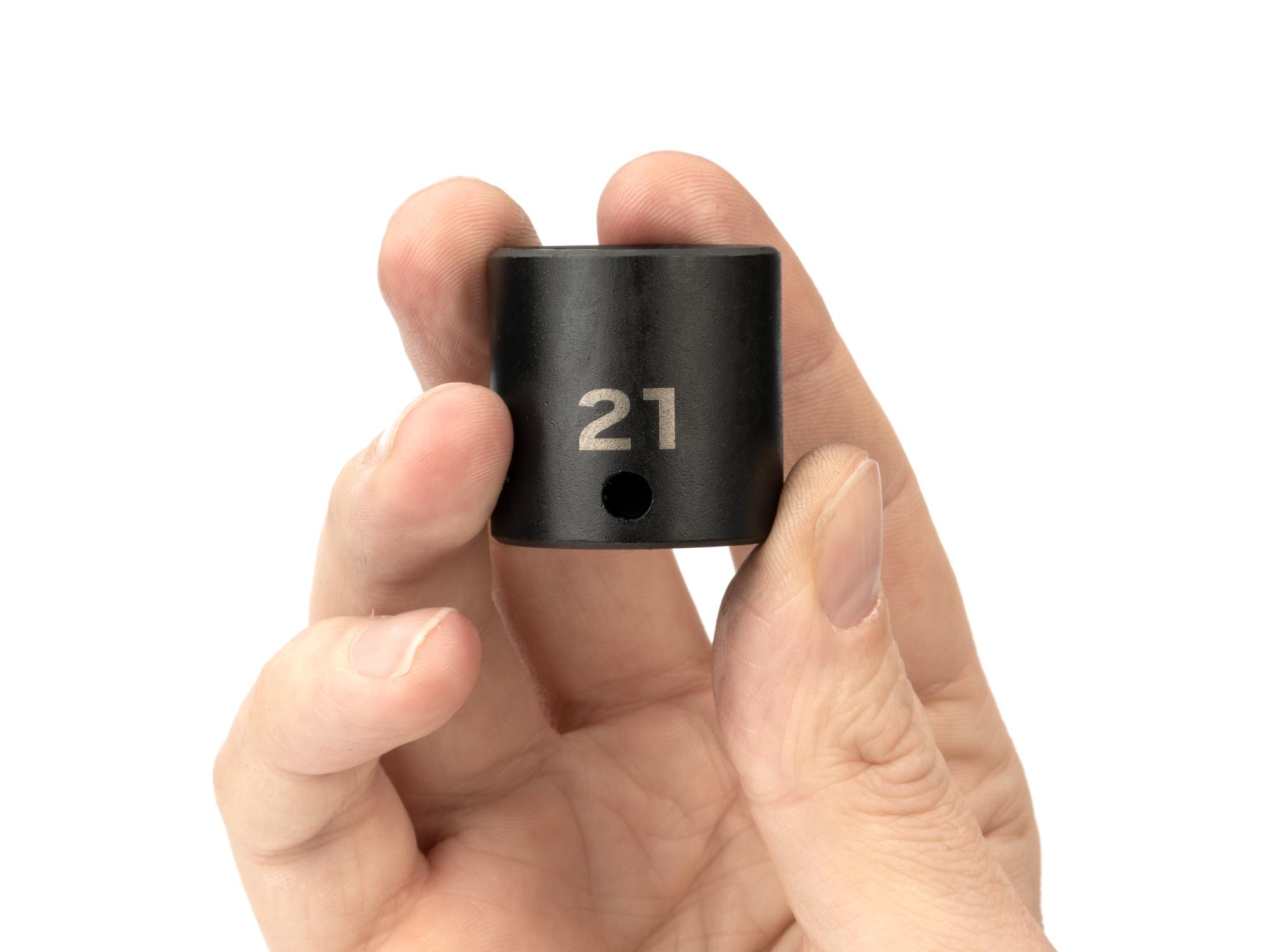 Person holding Tekton impact drive 6-point socket. Item #SID12121