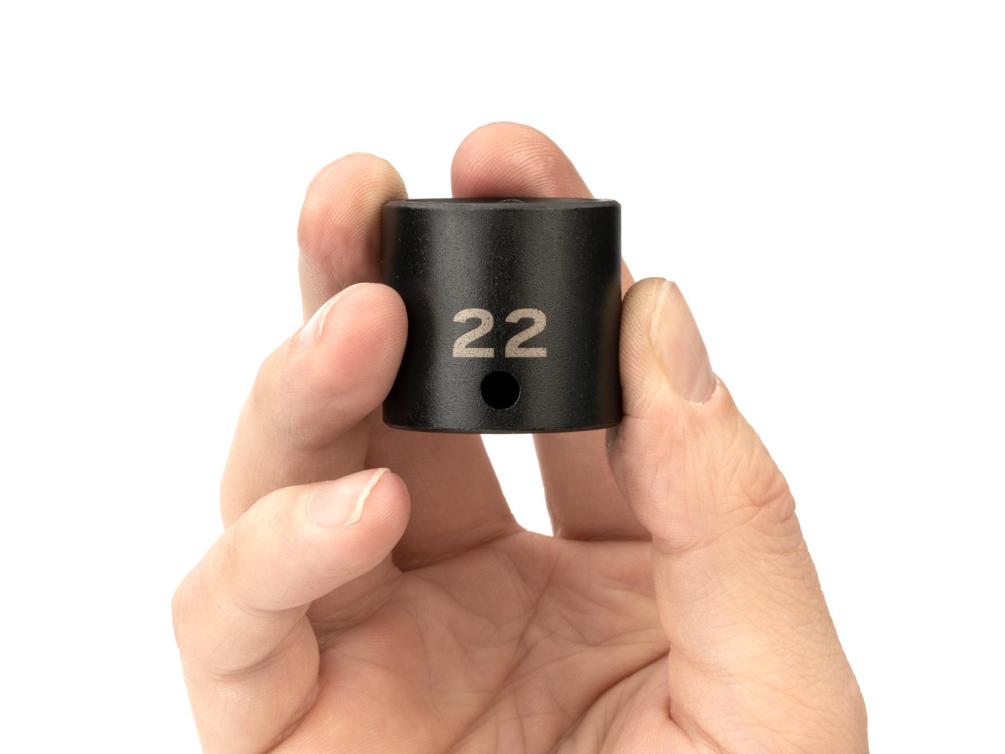 Person holding Tekton impact drive 6-point socket. Item #SID12122