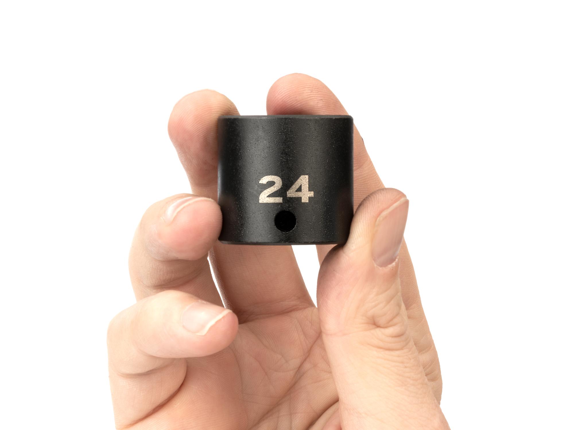 Person holding Tekton impact drive 6-point socket. Item #SID12124