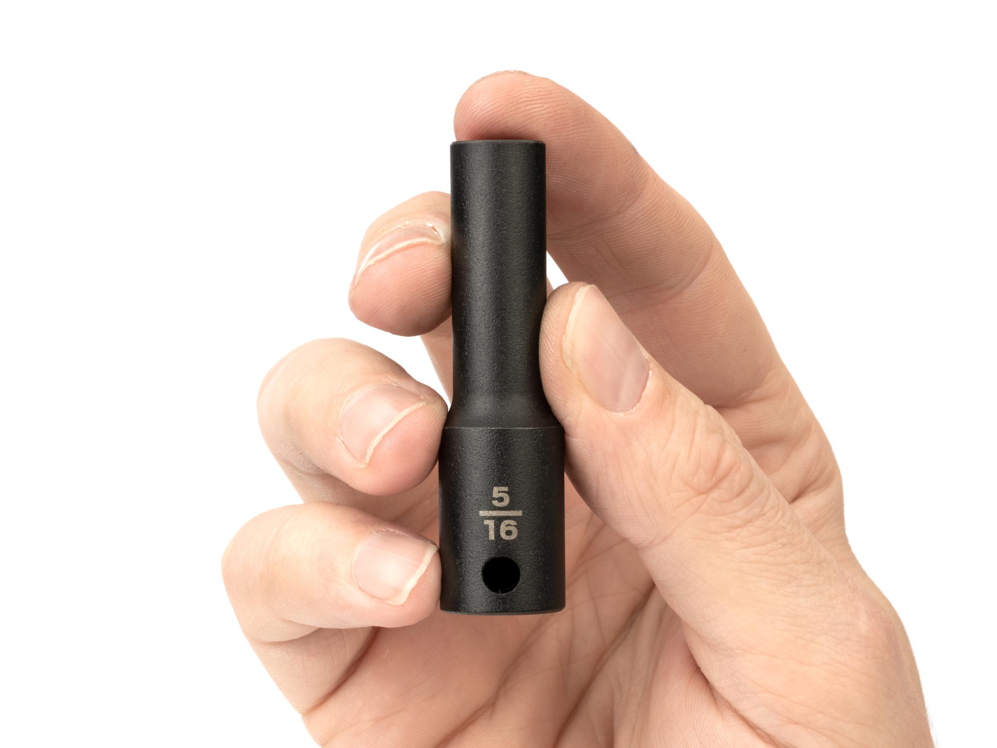 Person holding Tekton impact drive 6-point socket. Item #SID13008