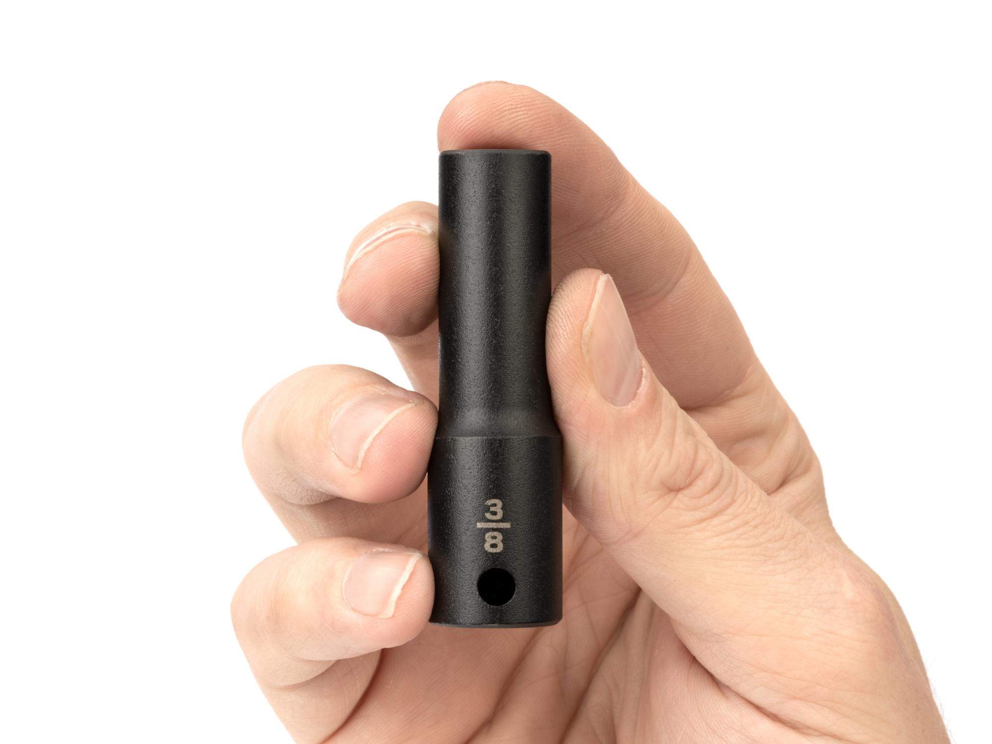 Person holding Tekton impact drive 6-point socket. Item #SID13010
