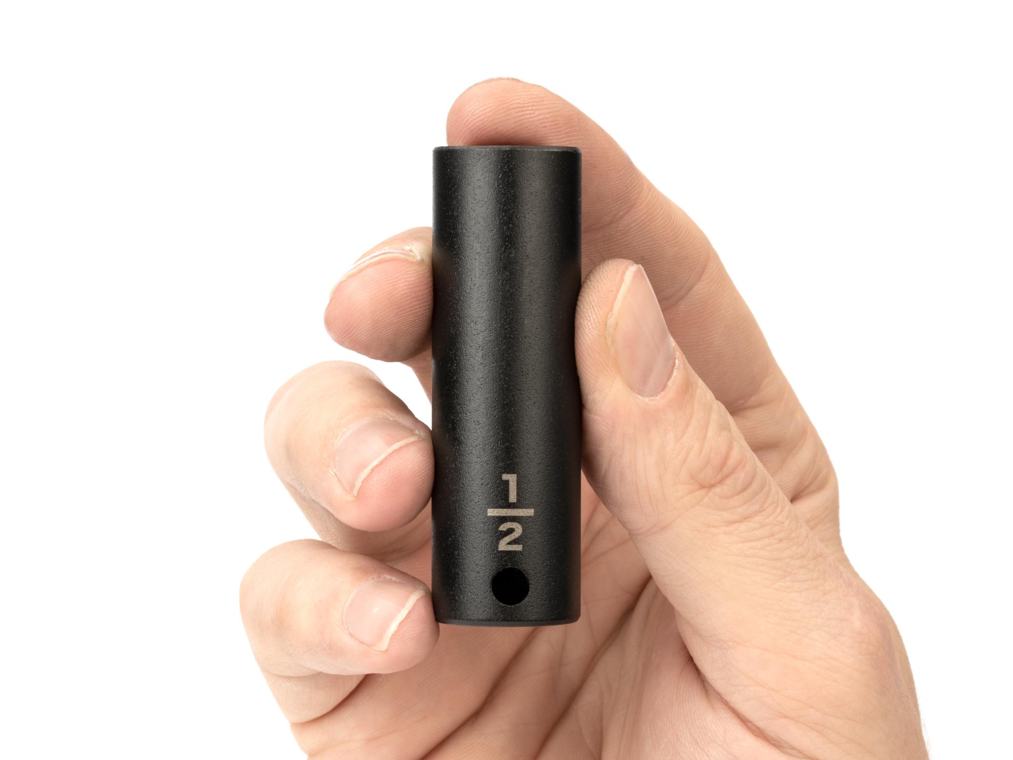 Person holding Tekton impact drive 6-point socket. Item #SID13013