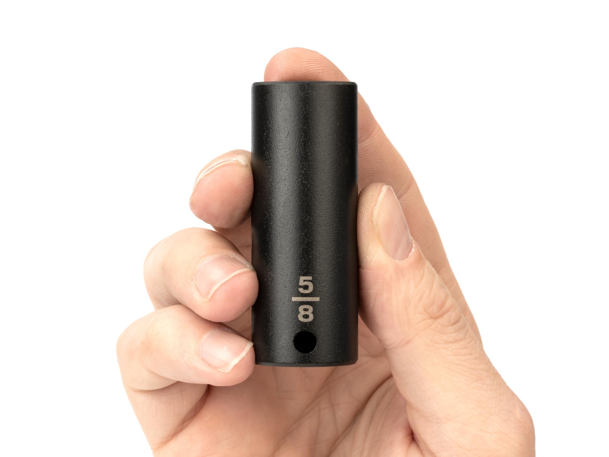 Person holding Tekton impact drive 6-point socket. Item #SID13016