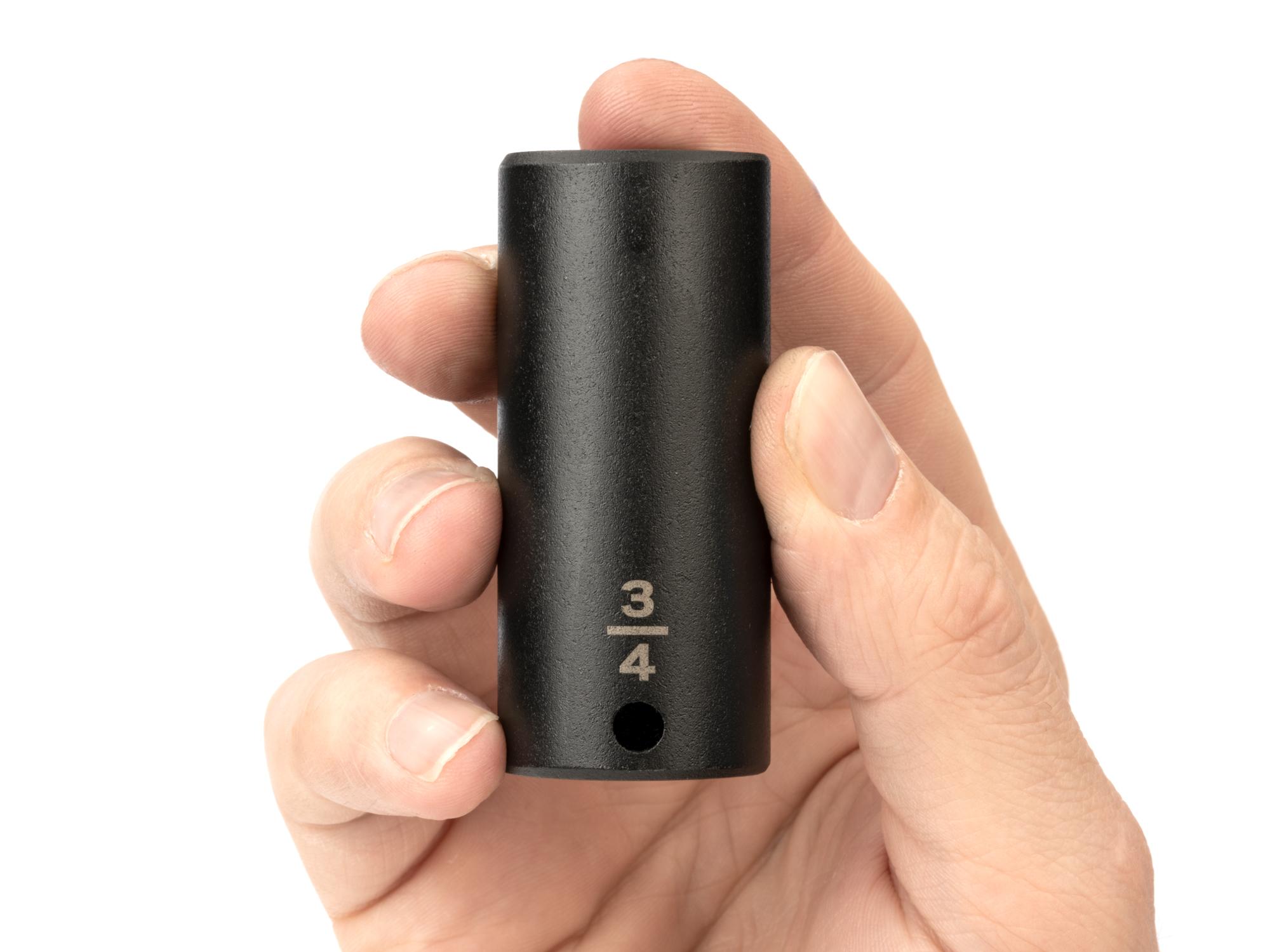 Person holding Tekton impact drive 6-point socket. Item #SID13019