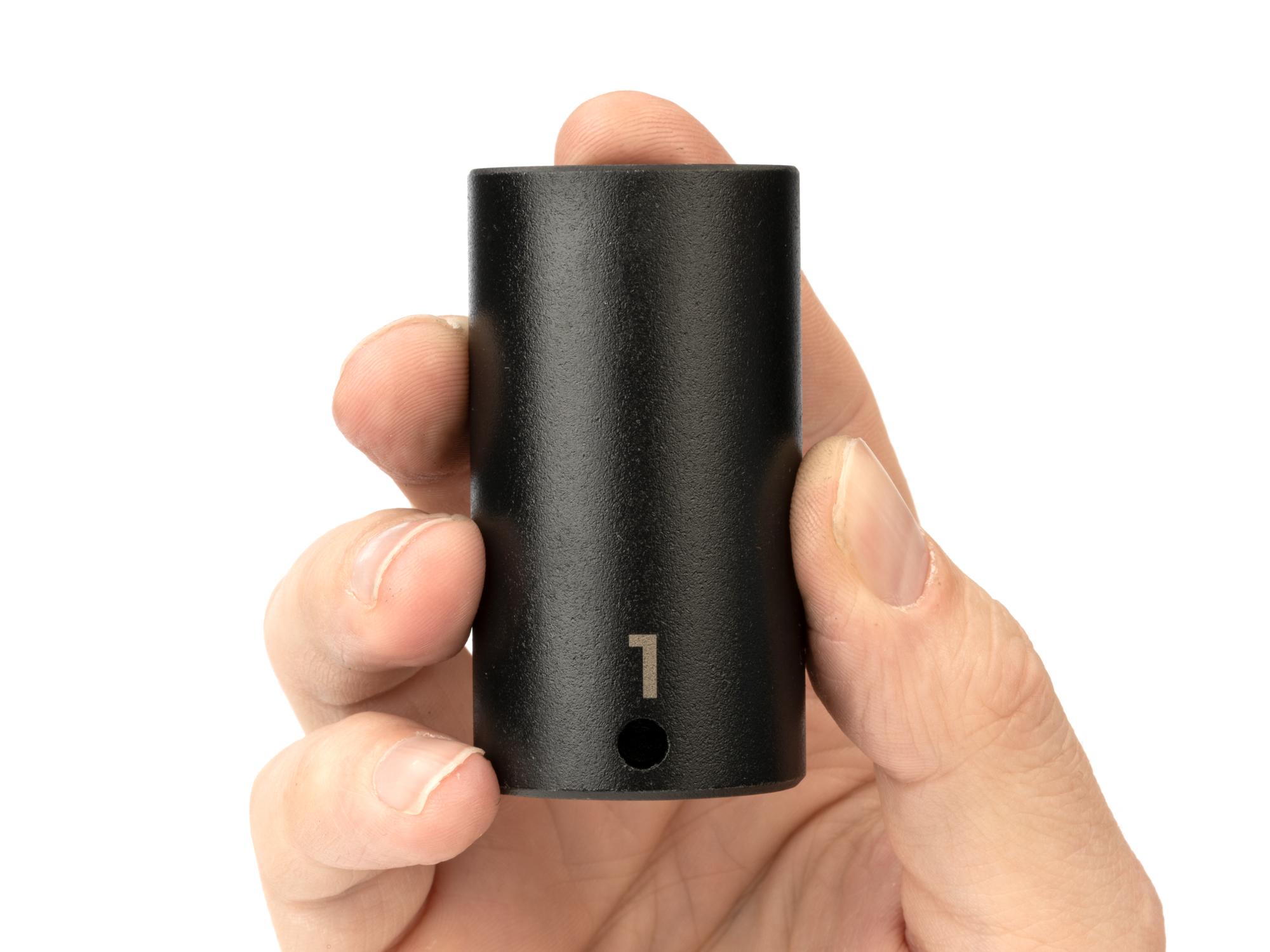 Person holding Tekton impact drive 6-point socket. Item #SID13025