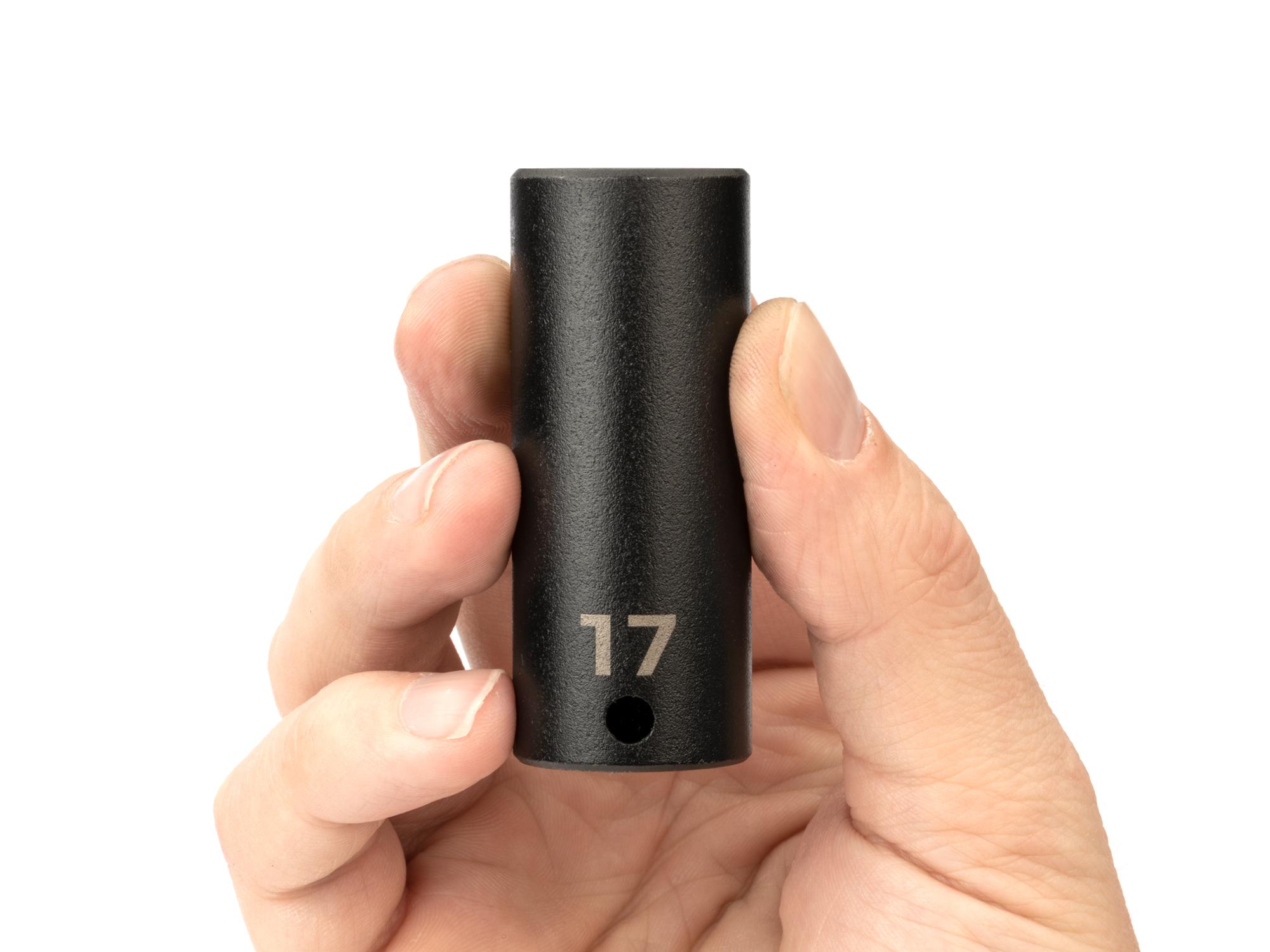 Person holding Tekton impact drive 6-point socket. Item #SID13117