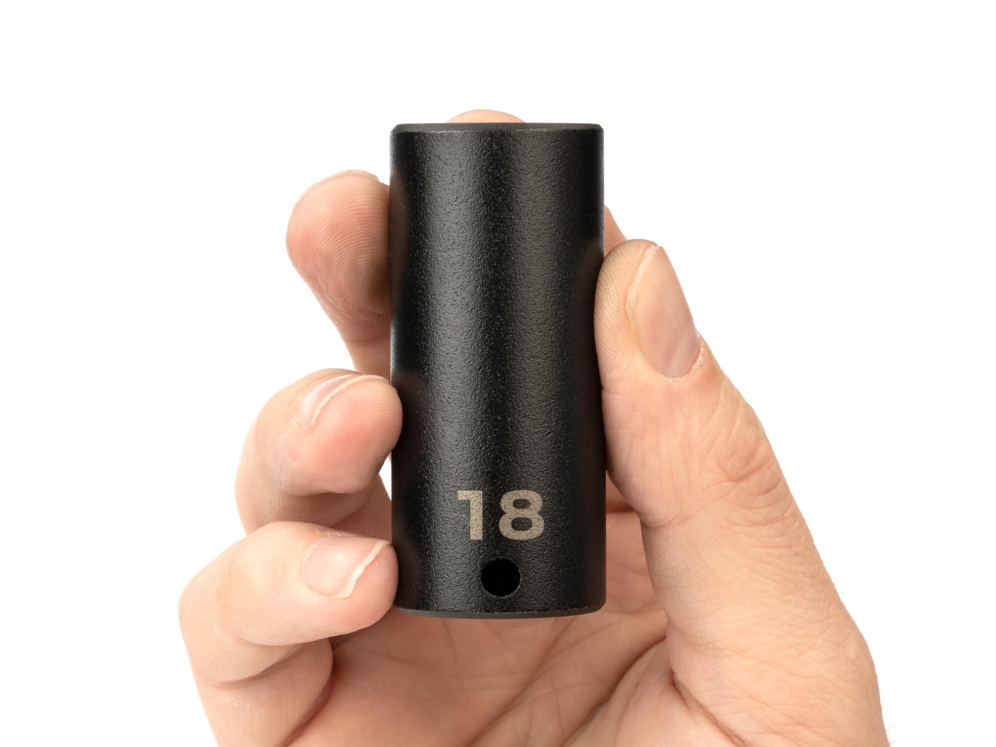 Person holding Tekton impact drive 6-point socket. Item #SID13118