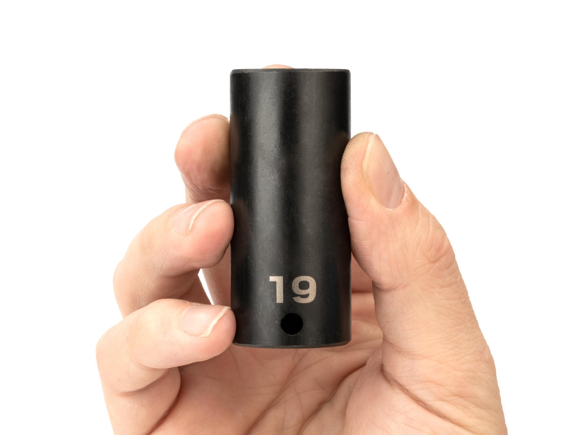 Person holding Tekton impact drive 6-point socket. Item #SID13119