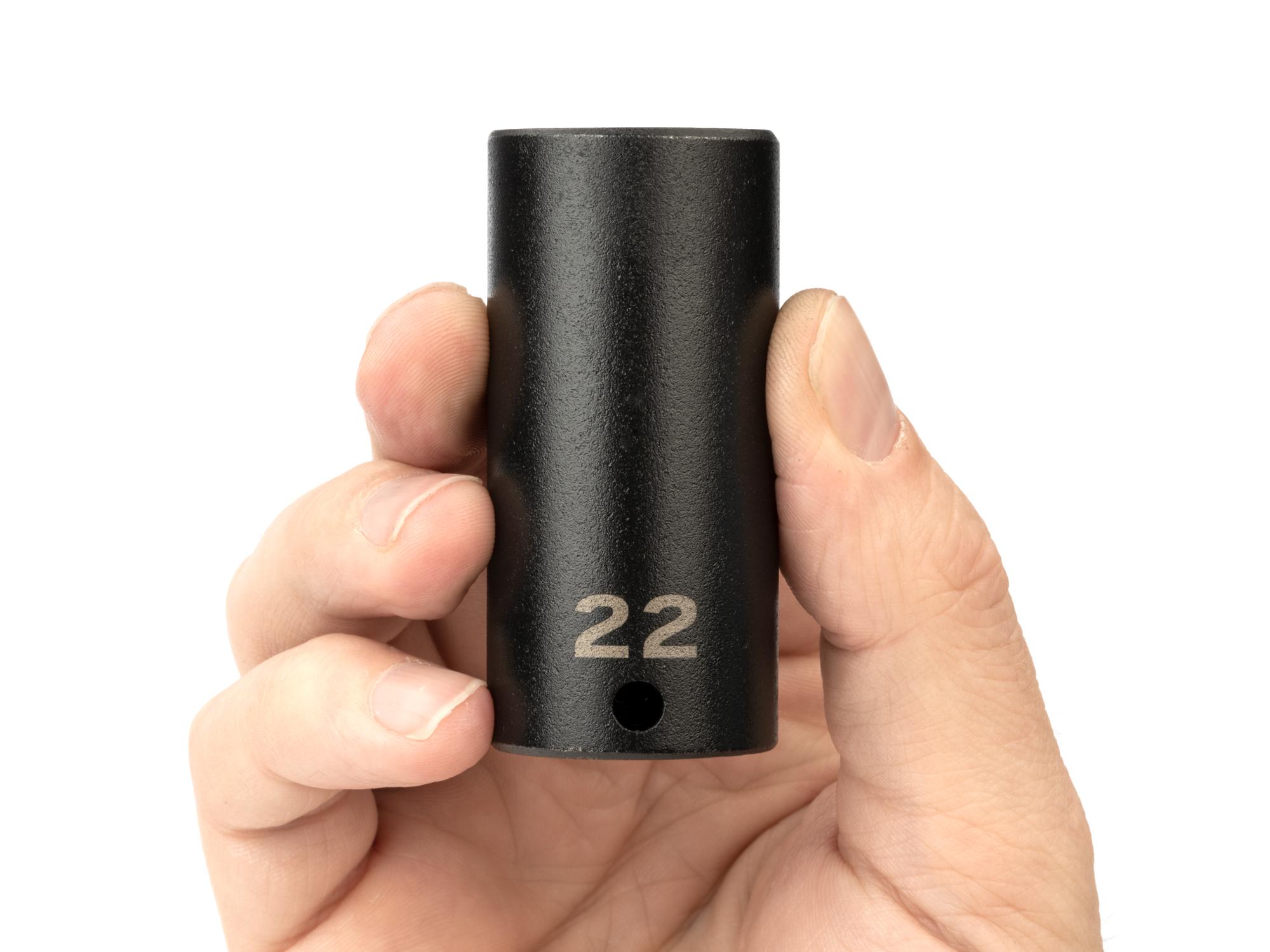 Person holding Tekton impact drive 6-point socket. Item #SID13122