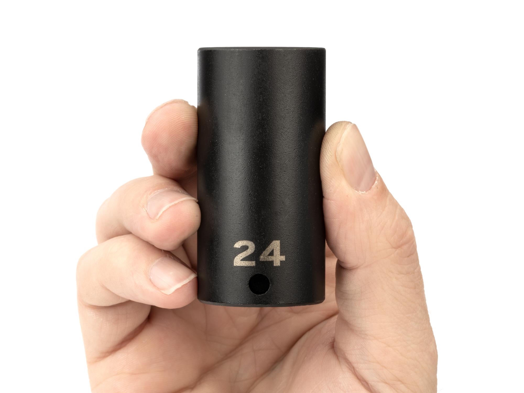 Person holding Tekton impact drive 6-point socket. Item #SID13124