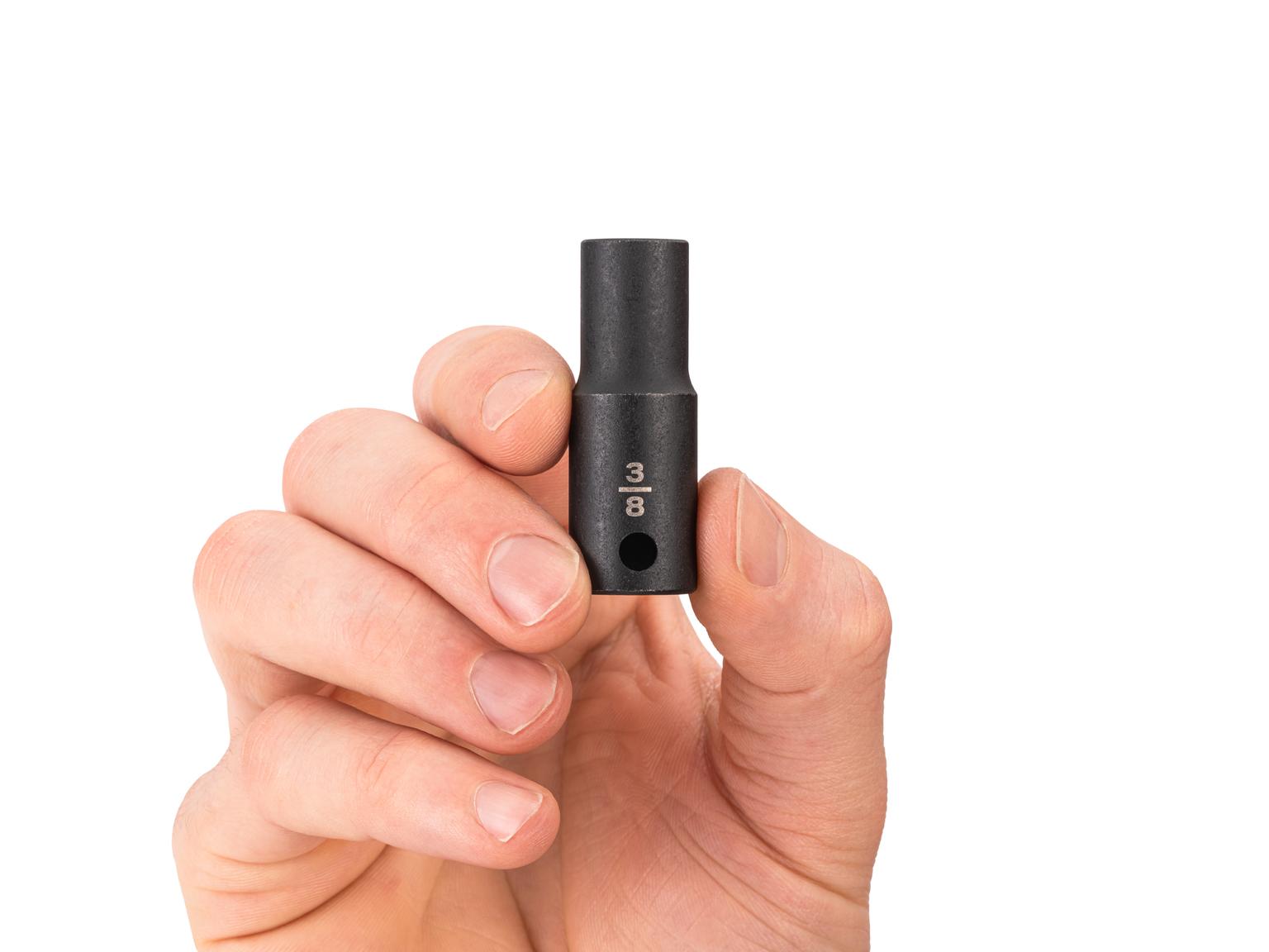 Person holding Tekton 3/8 inch impact drive 6-point socket. Item #SID14010