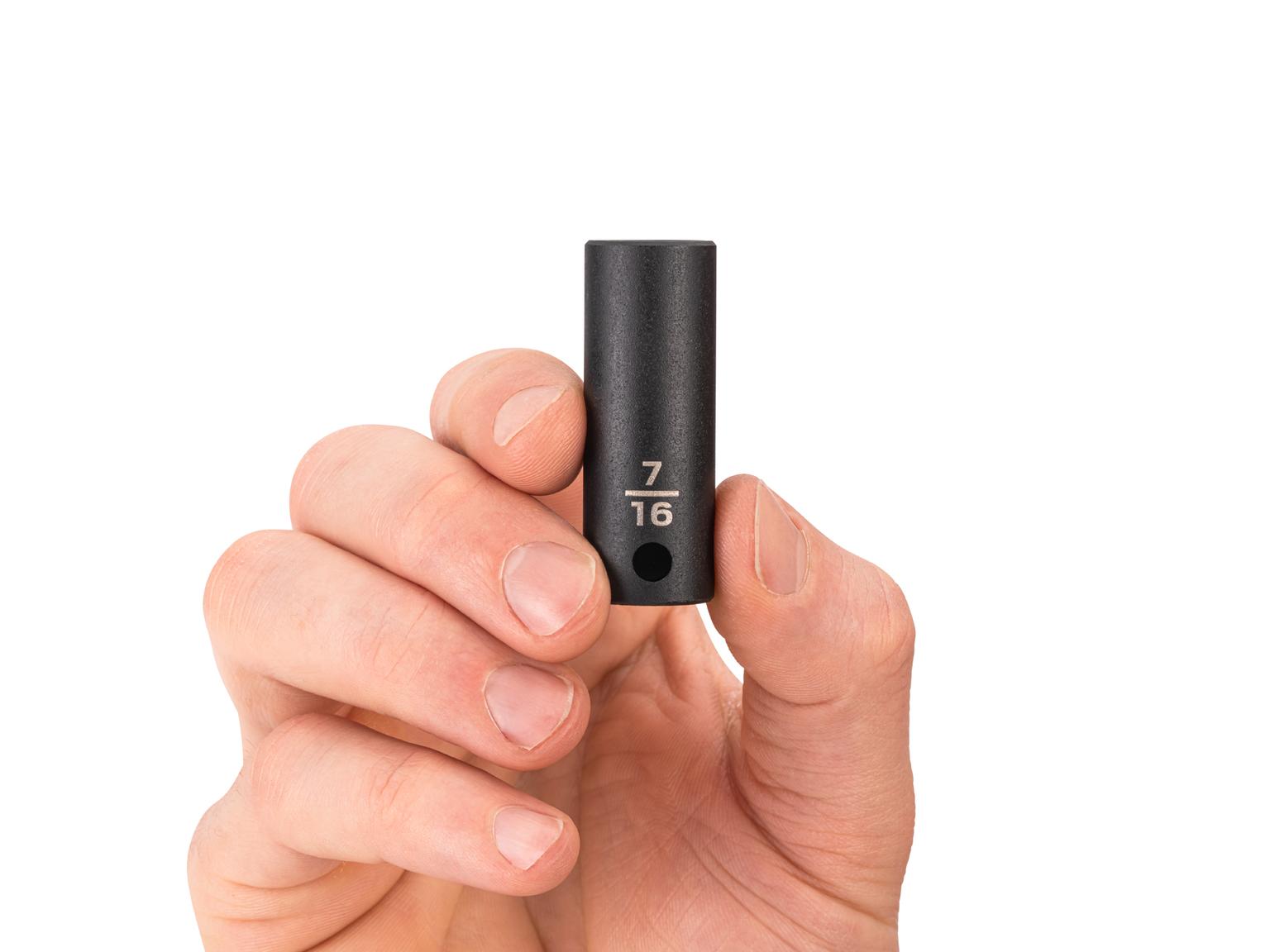 Person holding Tekton 7/16 inch impact drive 6-point socket. Item #SID14011
