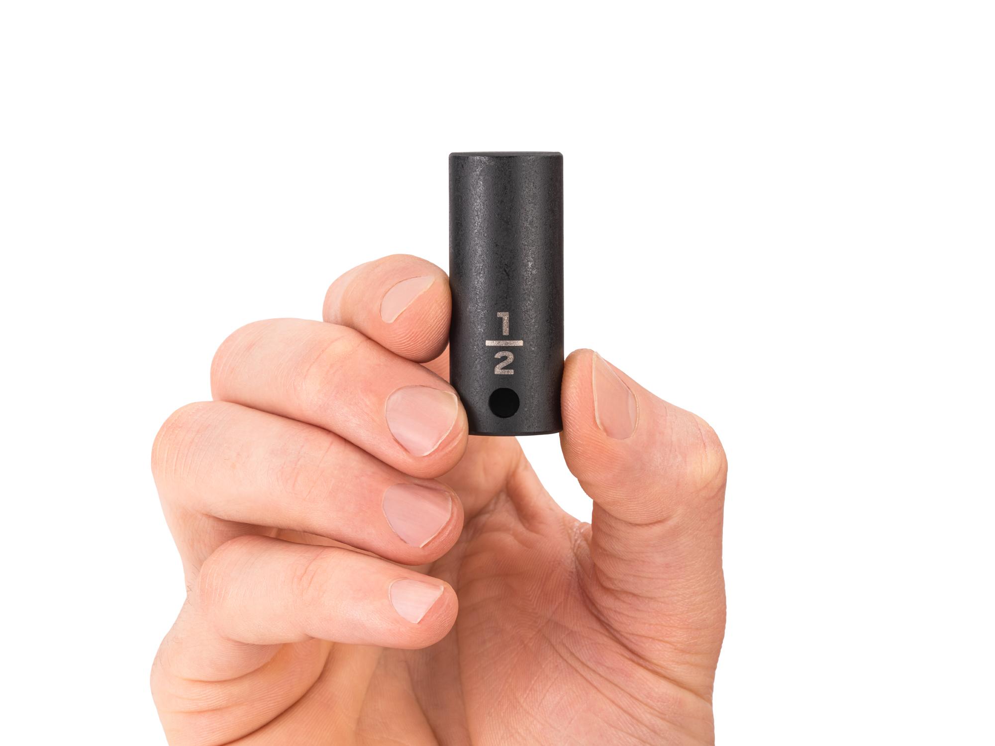Person holding Tekton impact drive 6-point socket. Item #SID14013