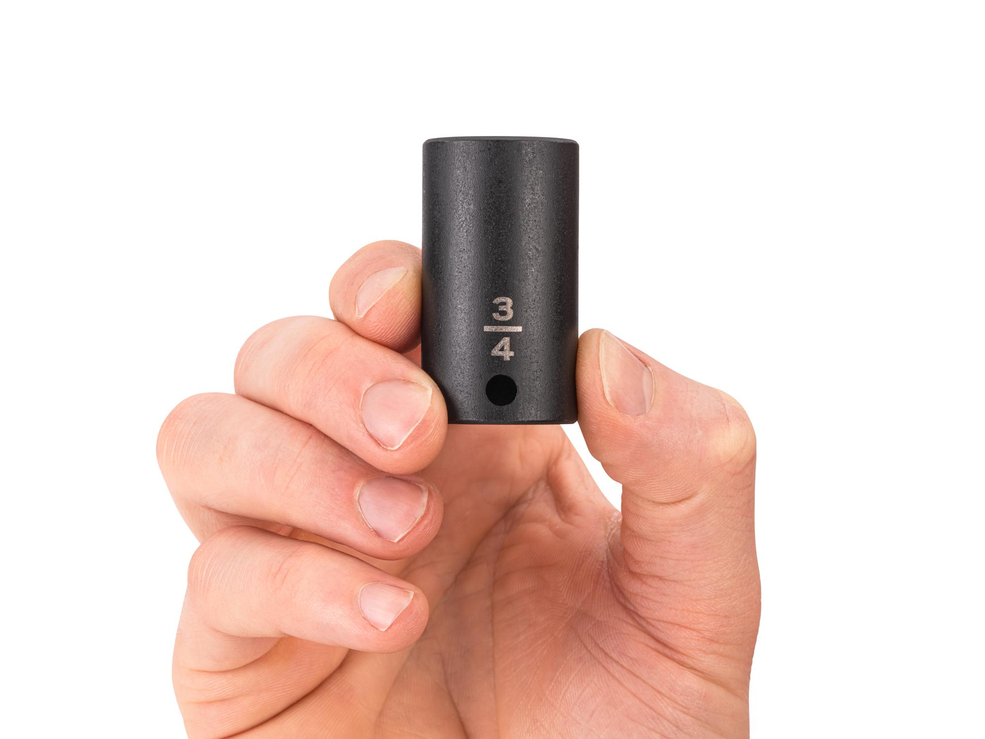 Person holding Tekton impact drive 6-point socket. Item #SID14019