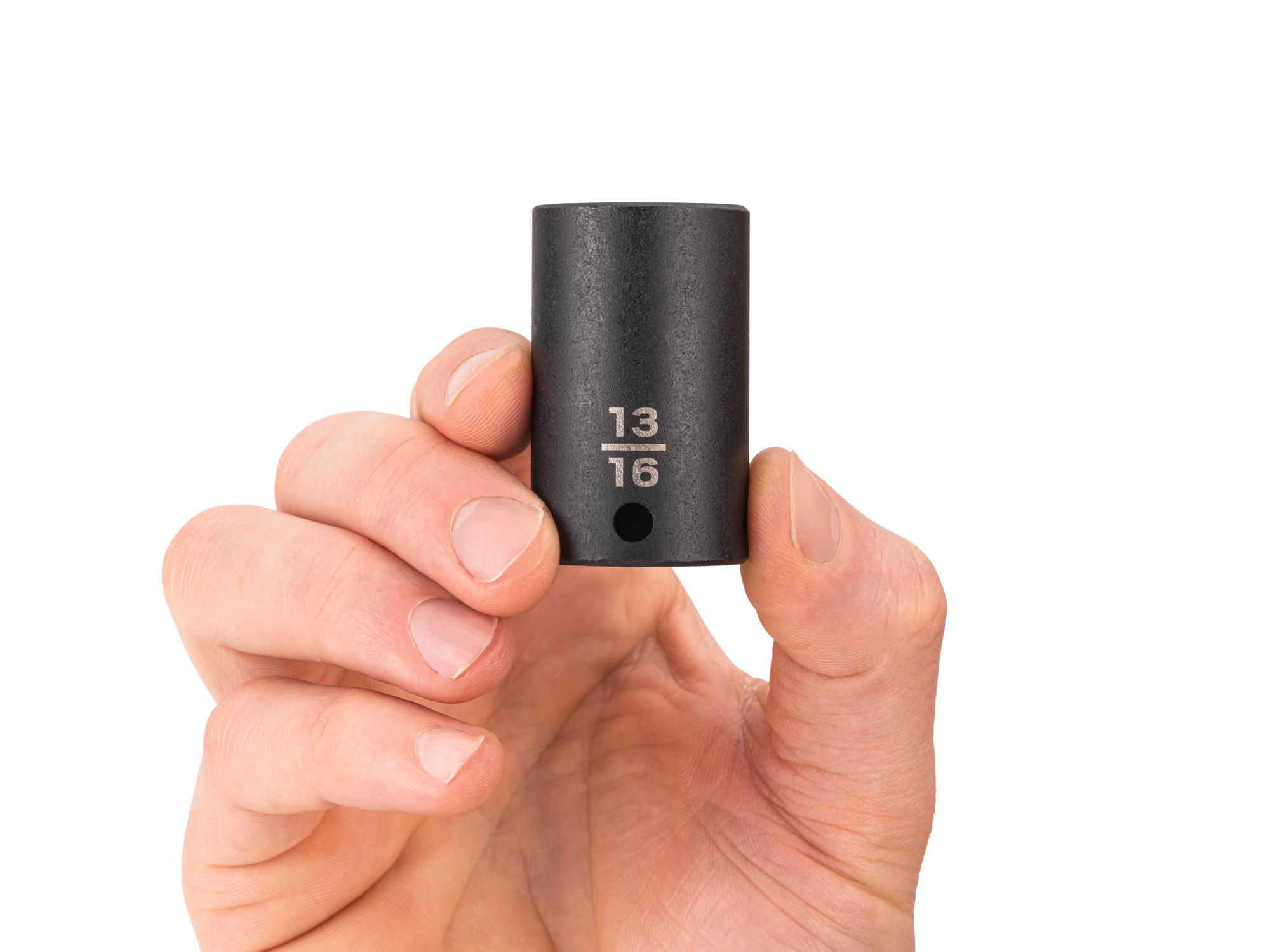 Person holding Tekton impact drive 6-point socket. Item #SID14021