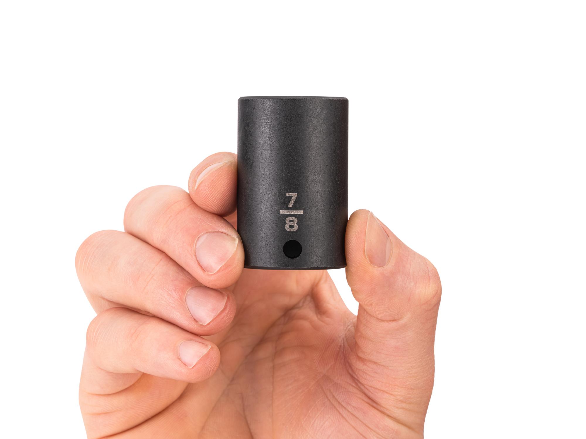 Person holding Tekton impact drive 6-point socket. Item #SID14022