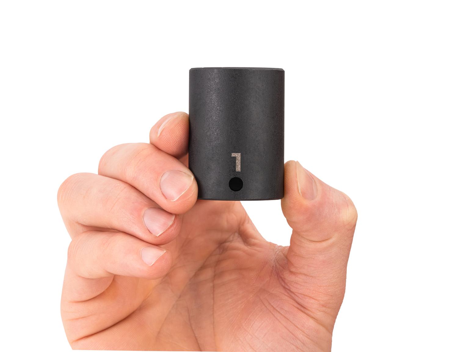 Person holding Tekton 1 inch impact drive 6-point socket. Item #SID14025