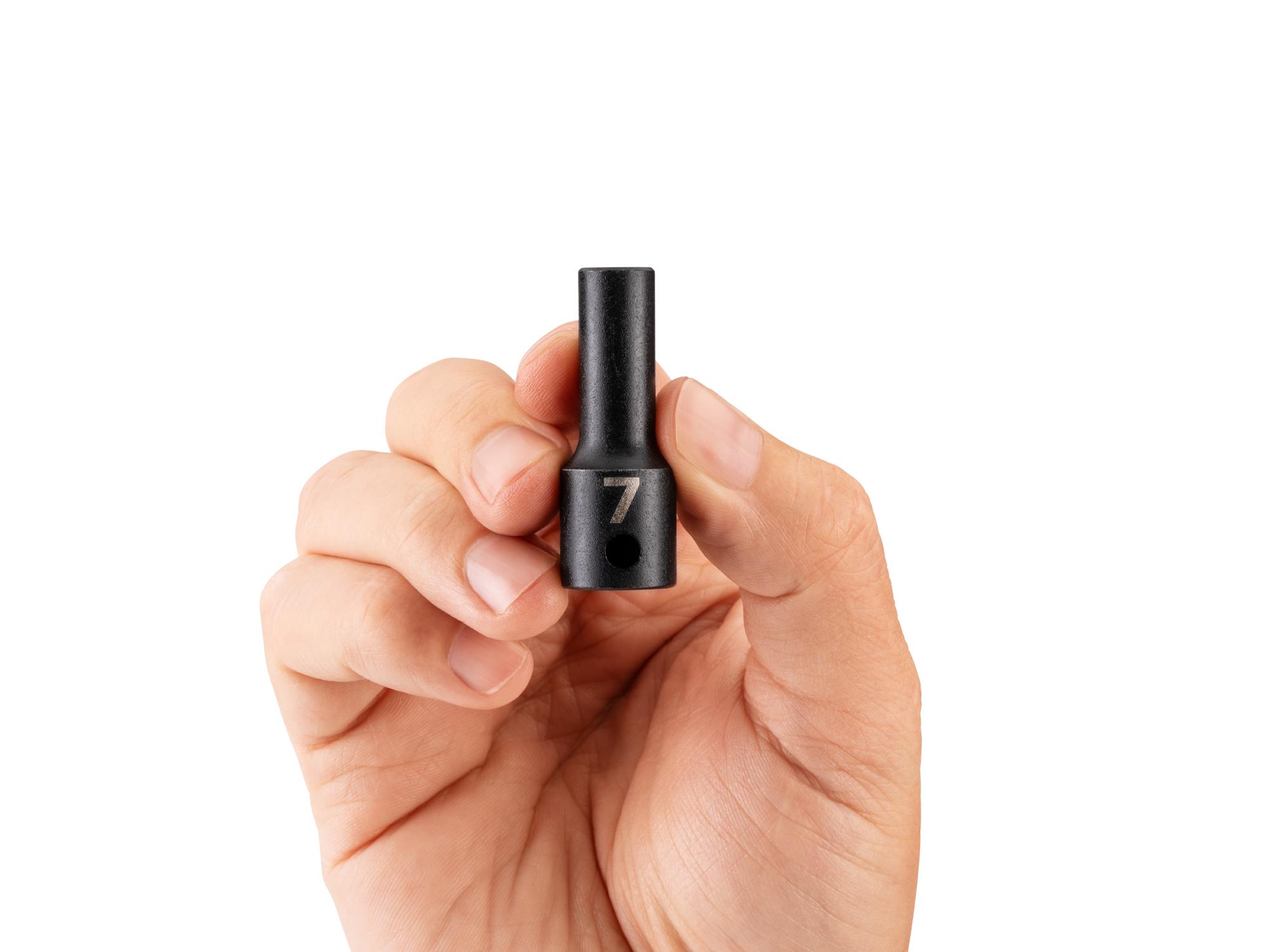 Person holding Tekton impact drive 6-point socket. Item #SID14107
