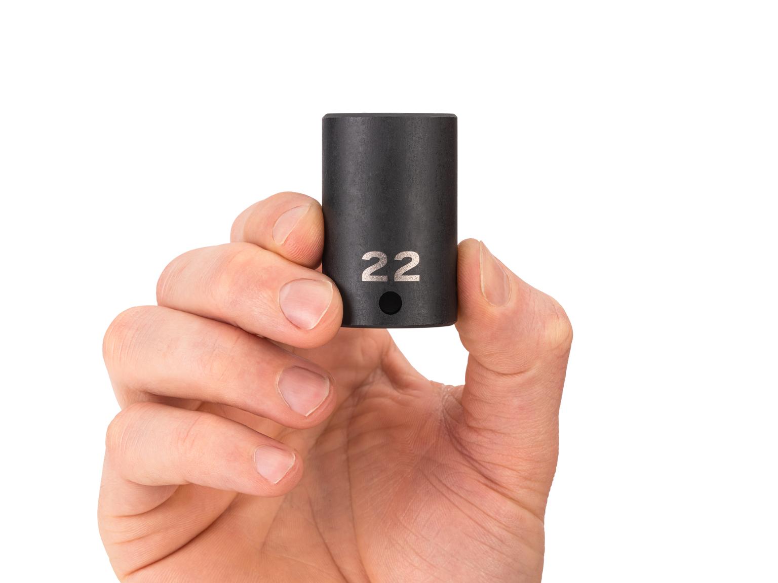 Person holding Tekton 22 millimeter impact drive 6-point socket. Item #SID14122