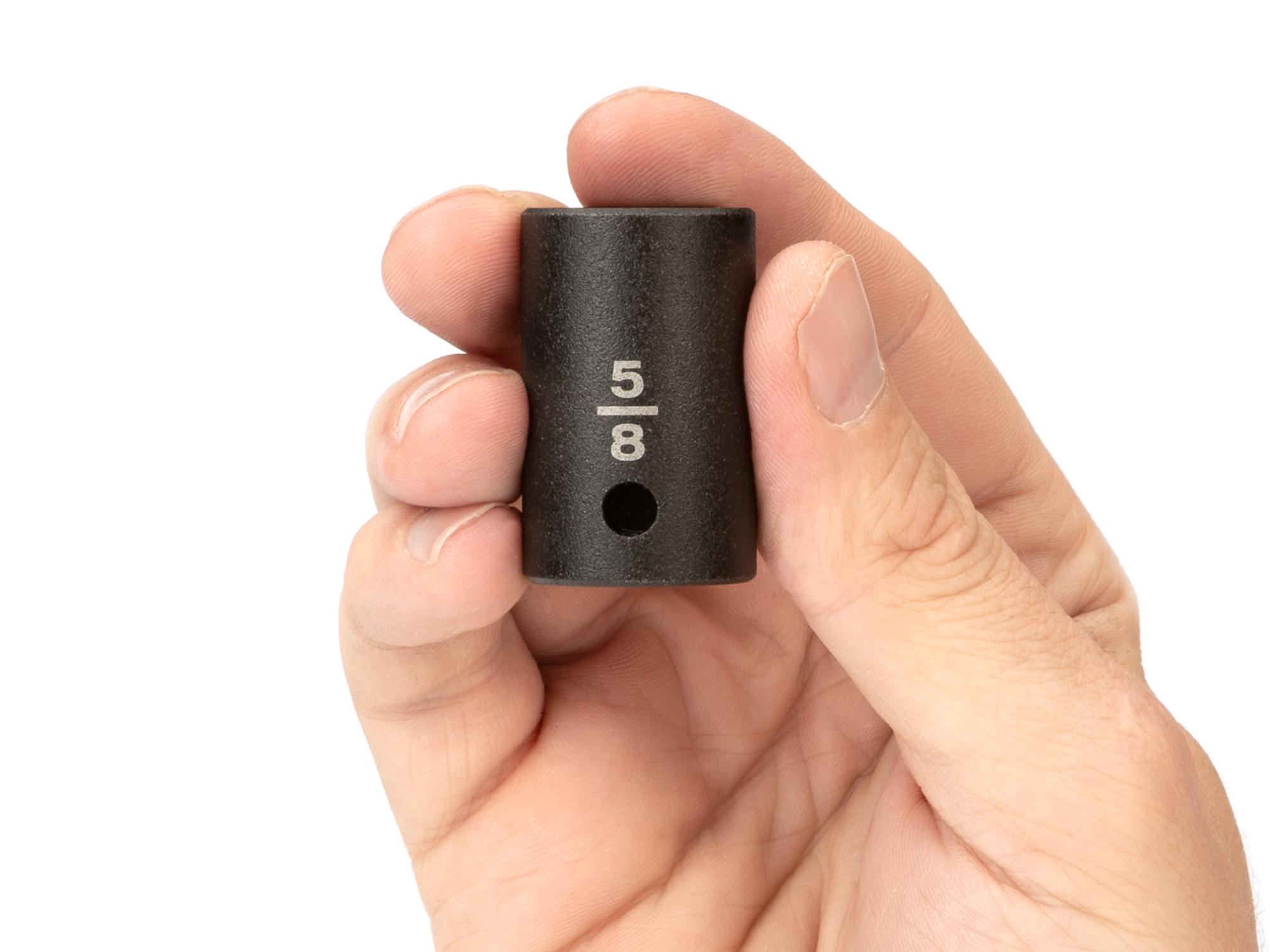 Person holding Tekton impact drive 6-point socket. Item #SID22016