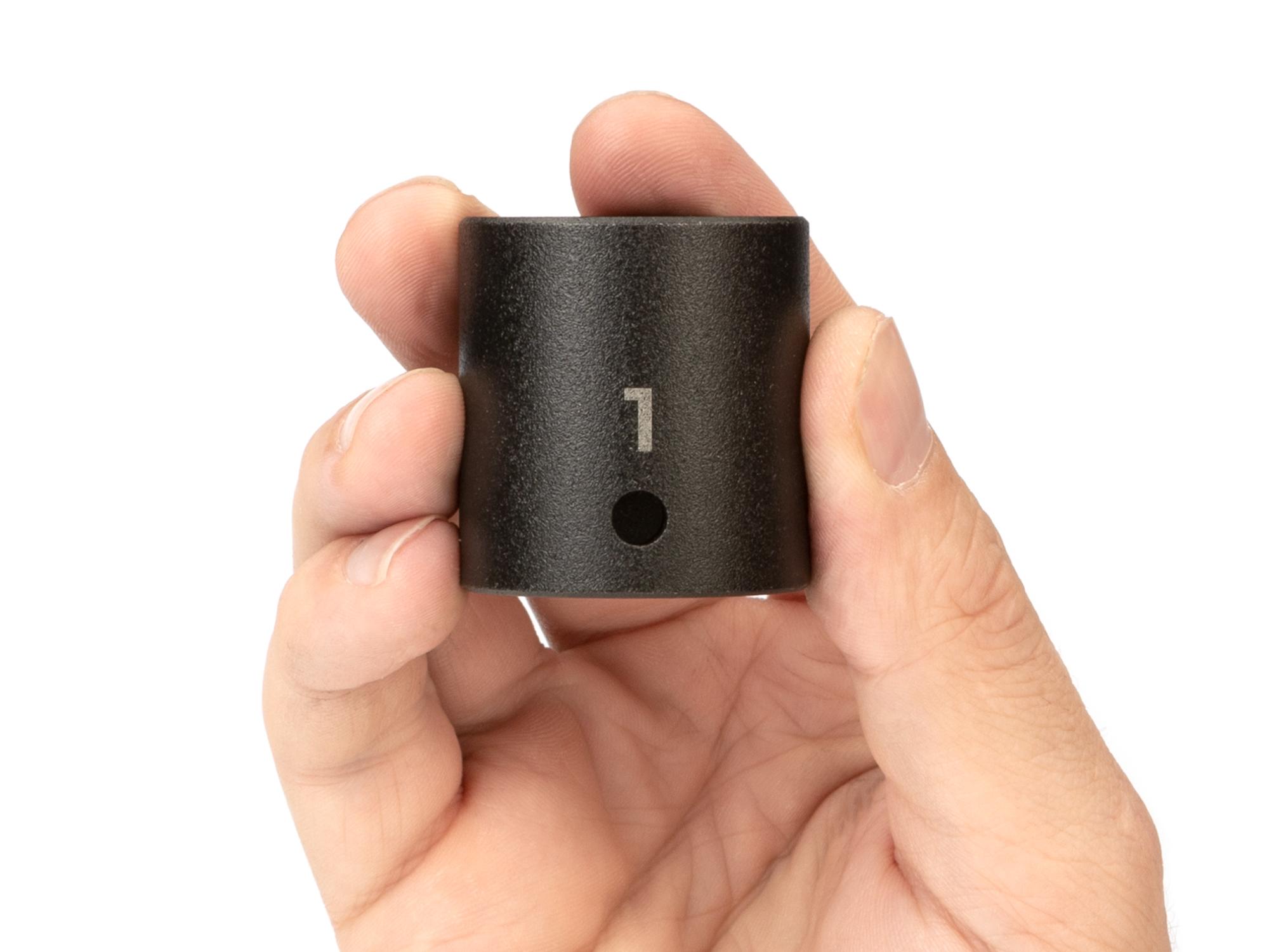 Person holding Tekton impact drive 6-point socket. Item #SID22025