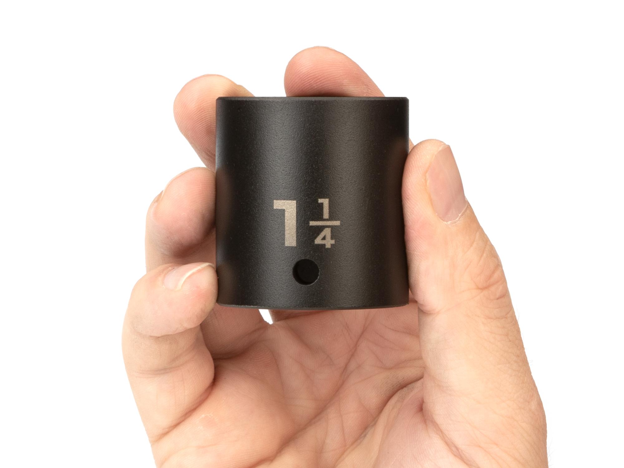 Person holding Tekton impact drive 6-point socket. Item #SID22032