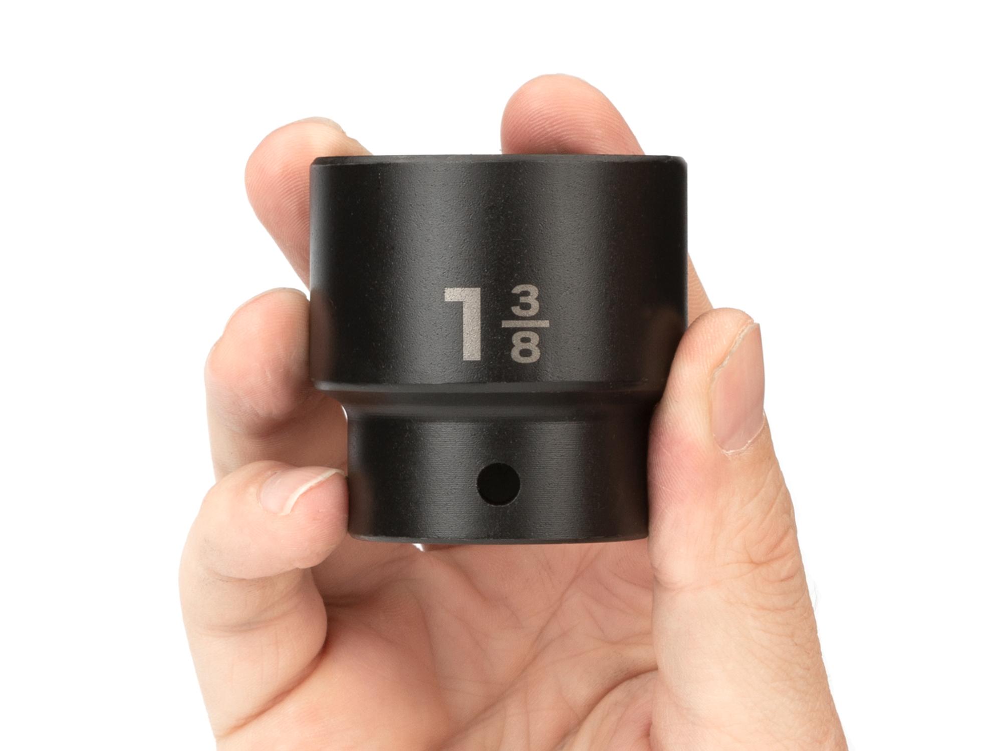 Person holding Tekton impact drive 6-point socket. Item #SID22035