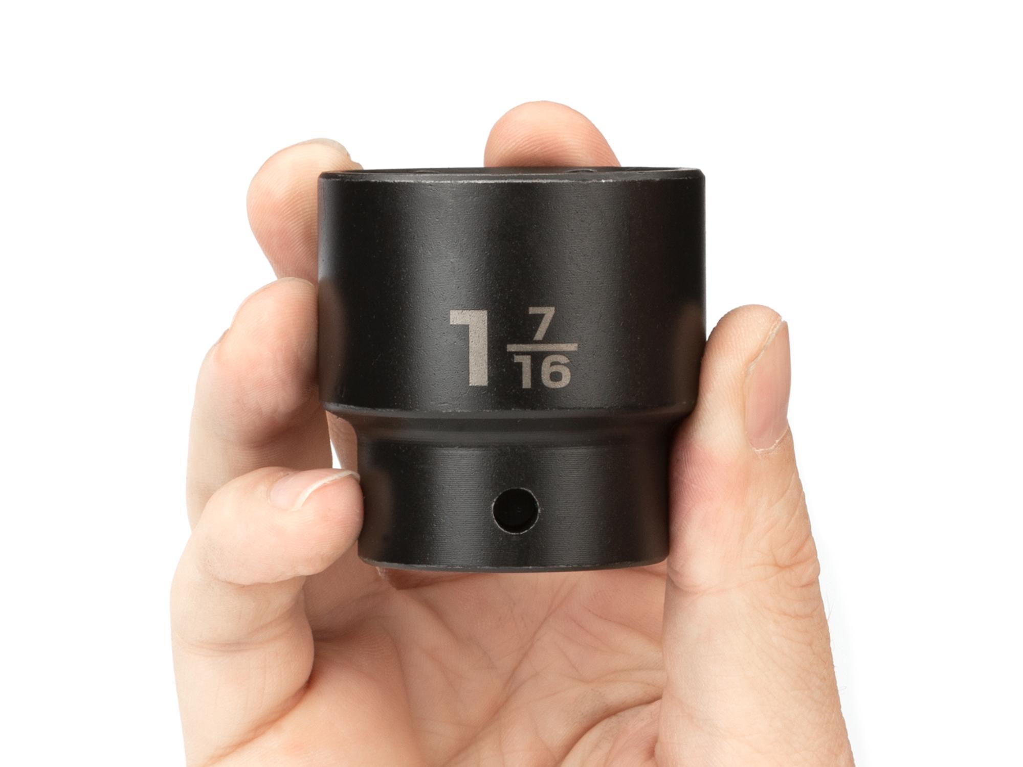 Person holding Tekton impact drive 6-point socket. Item #SID22036