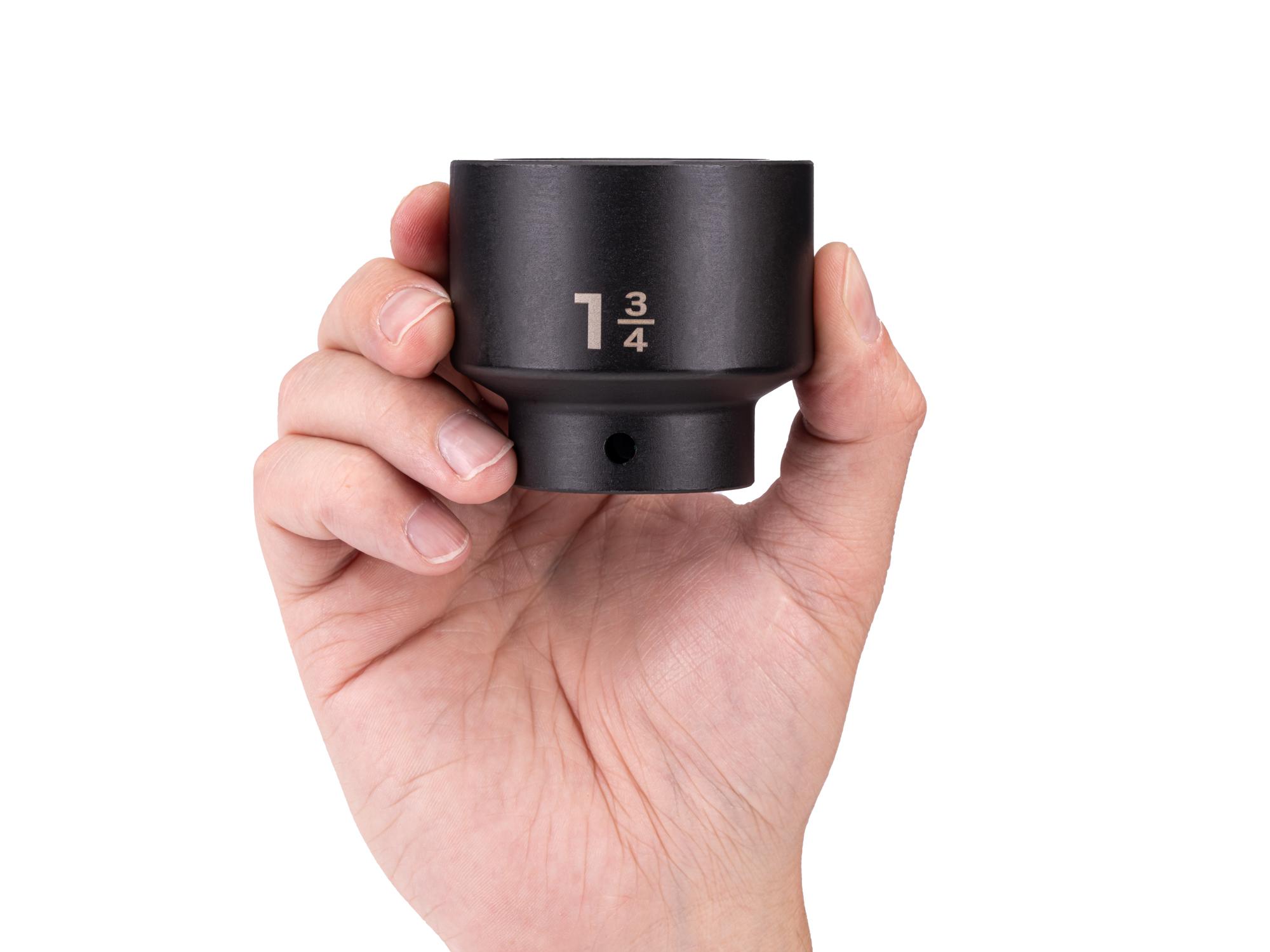 Person holding Tekton impact drive 6-point socket. Item #SID22045