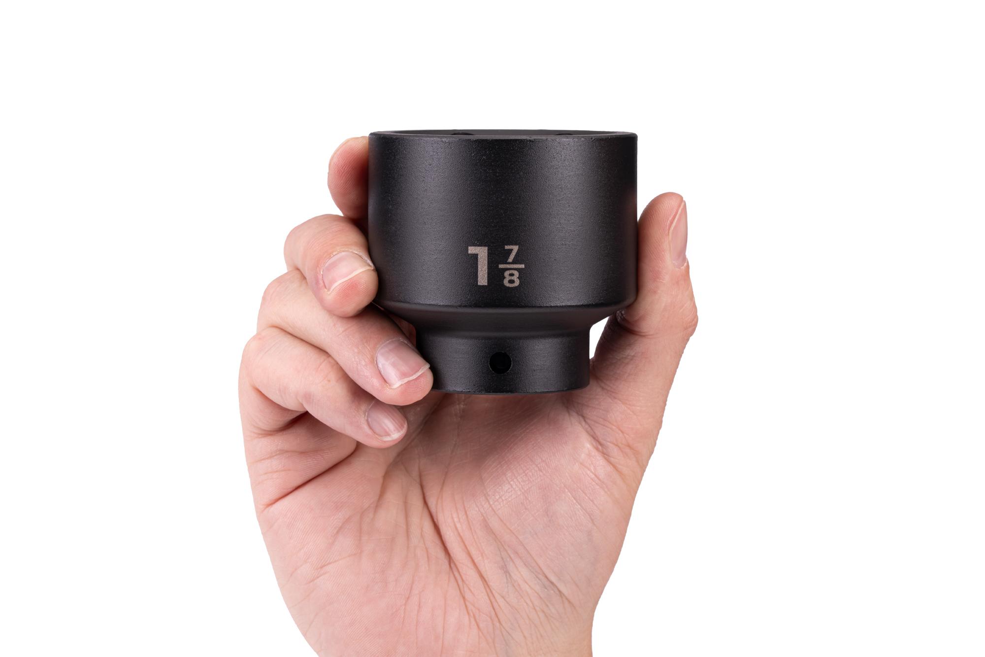 Person holding Tekton impact drive 6-point socket. Item #SID22048