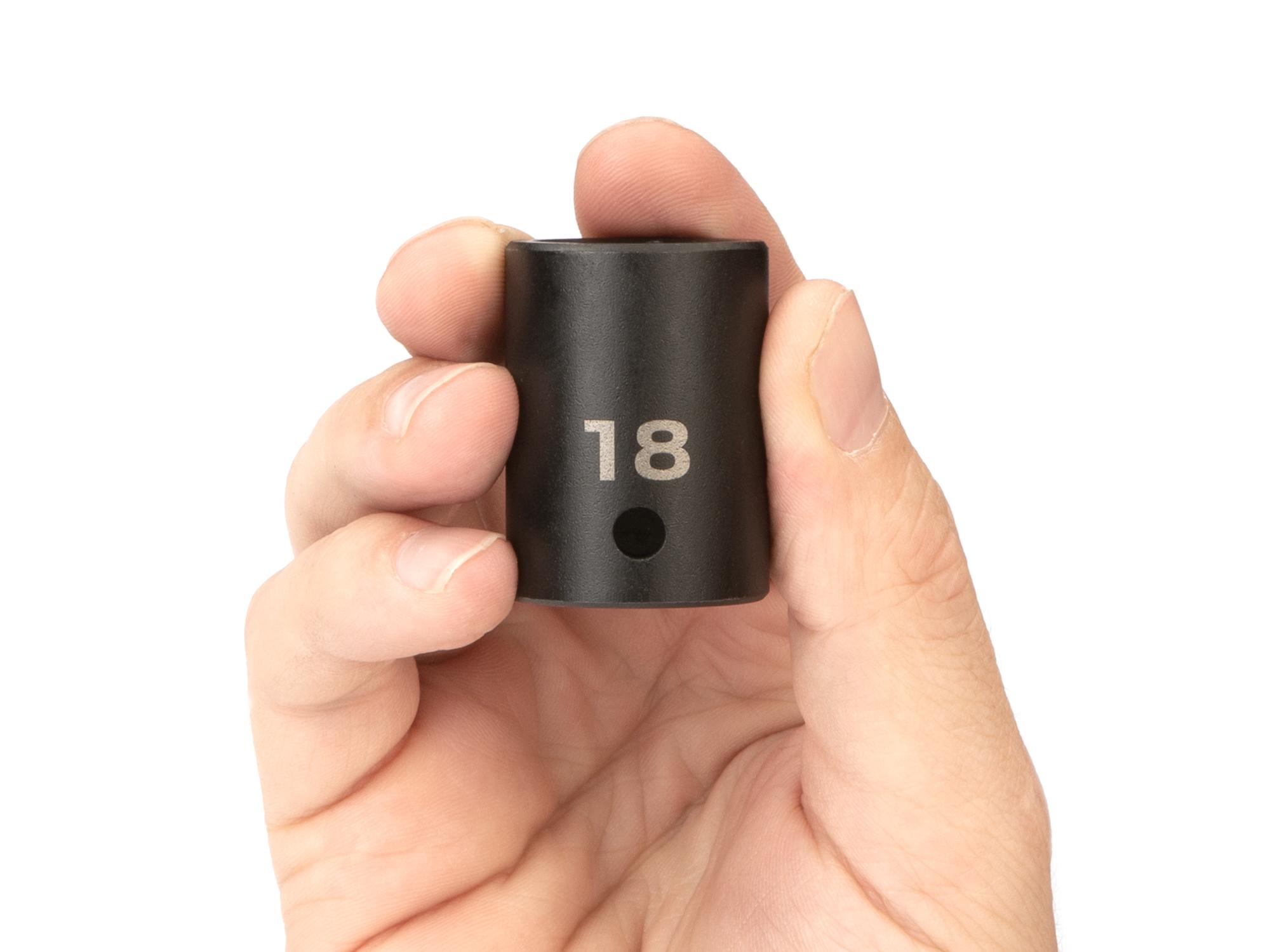 Person holding Tekton impact drive 6-point socket. Item #SID22118