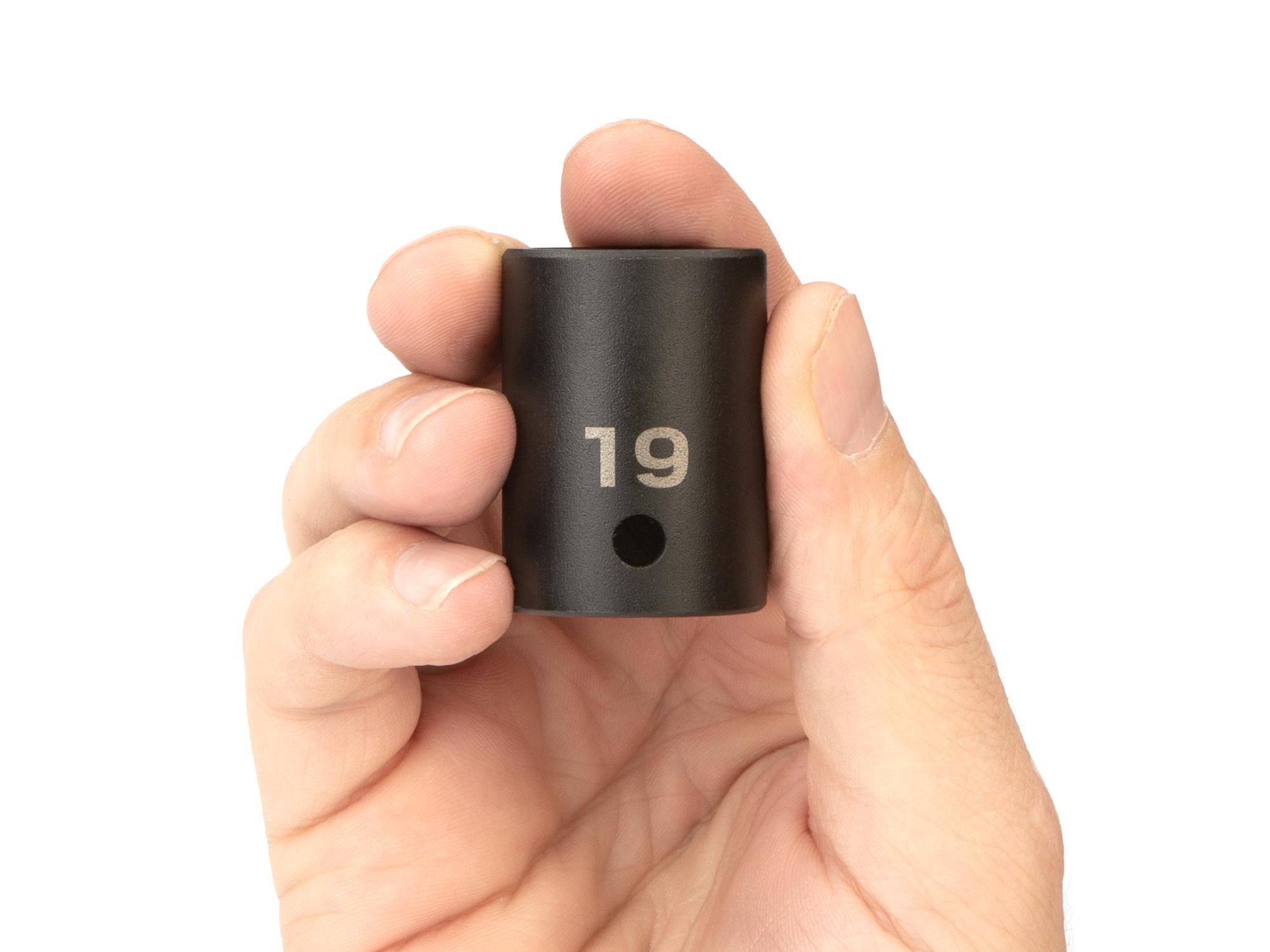 Person holding Tekton impact drive 6-point socket. Item #SID22119
