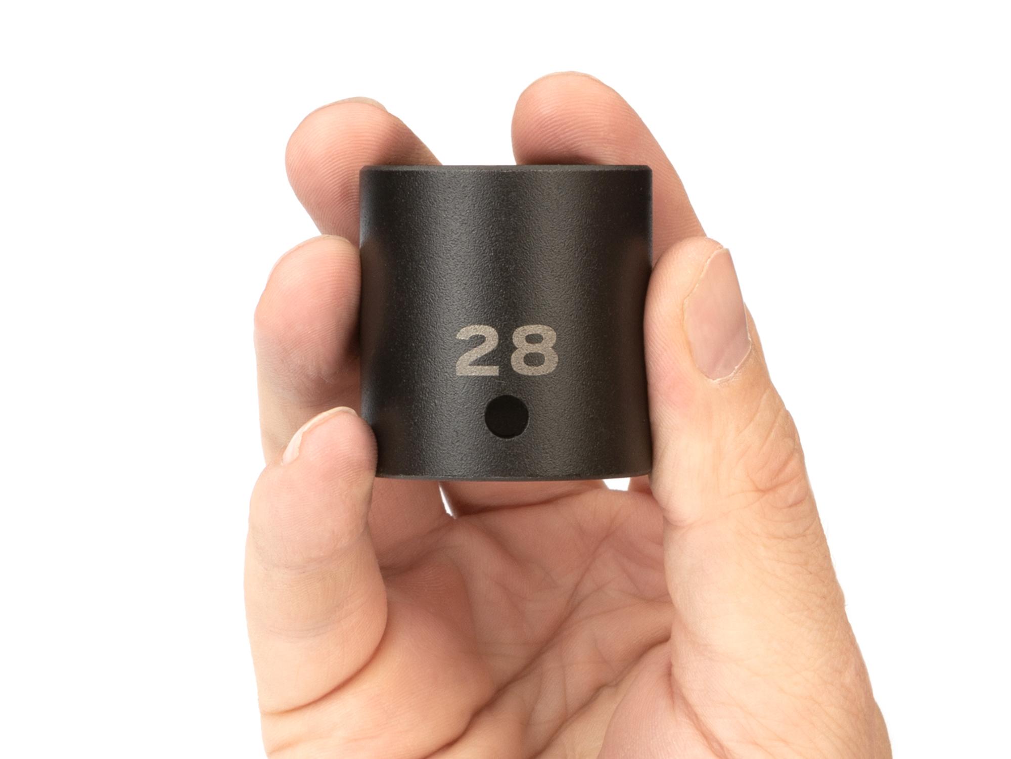 Person holding Tekton impact drive 6-point socket. Item #SID22128